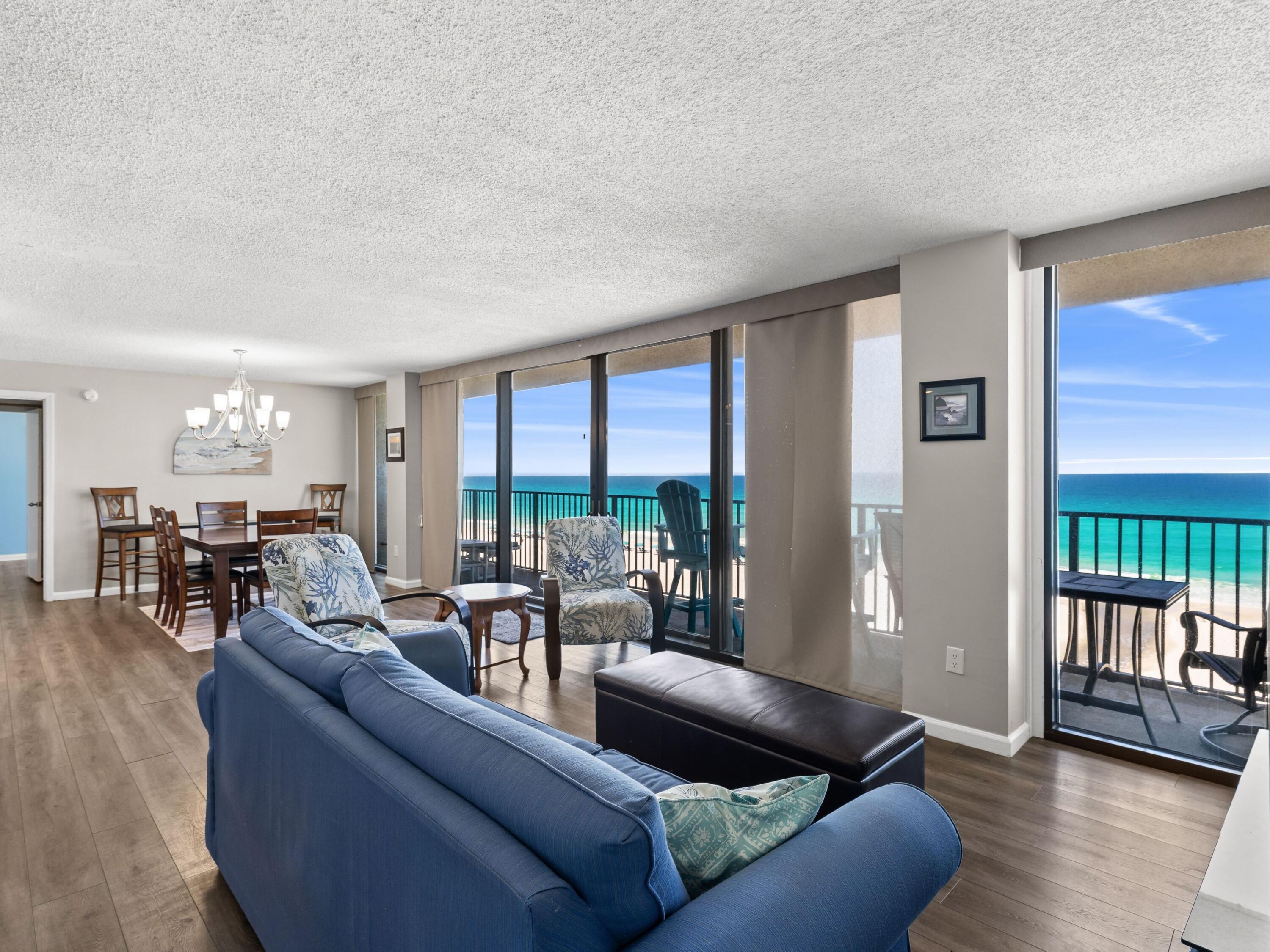Floor-to-ceiling windows, two gulf-front bedrooms and a low-density beachfront setting create a rare sense of openness in this Seachase condominium. With approximately 1,400 square feet, two bedrooms and two baths, the residence is designed to keep the water in view from nearly every room.

The open living, dining and kitchen areas offer an easy layout for everyday living, vacation stays or rental guests, with new hurricane-rated double sliding glass doors that open directly to the sights and sounds of the shoreline. Wall-spanning windows frame the emerald water beyond, filling the interiors with natural light and giving the main living area an immediate connection to the beach.

Both bedrooms enjoy direct gulf views, a standout feature that adds privacy, symmetry and strong rental appeal. The split-bedroom floor plan creates comfortable separation for owners and guests, while the spacious design allows the condo to live larger than expected.

Seachase is a lower-density gulf-front complex with only 64 residences spread across two buildings, creating a more relaxed coastal experience than larger resort-style properties. Owners and guests enjoy expansive beach frontage, a beachfront pool, pet-friendly ownership and short-term rental flexibility. The location adds another layer of convenience, with McGuire's Irish Pub within walking distance and Pier Park, Dolly Parton's Pirate Voyage Dinner and Show, Topgolf, Northwest Florida Beaches International Airport and Inlet Beach all within easy reach. With limited opportunities in this beachfront complex, this residence offers compelling potential for personal enjoyment, rental income or both.