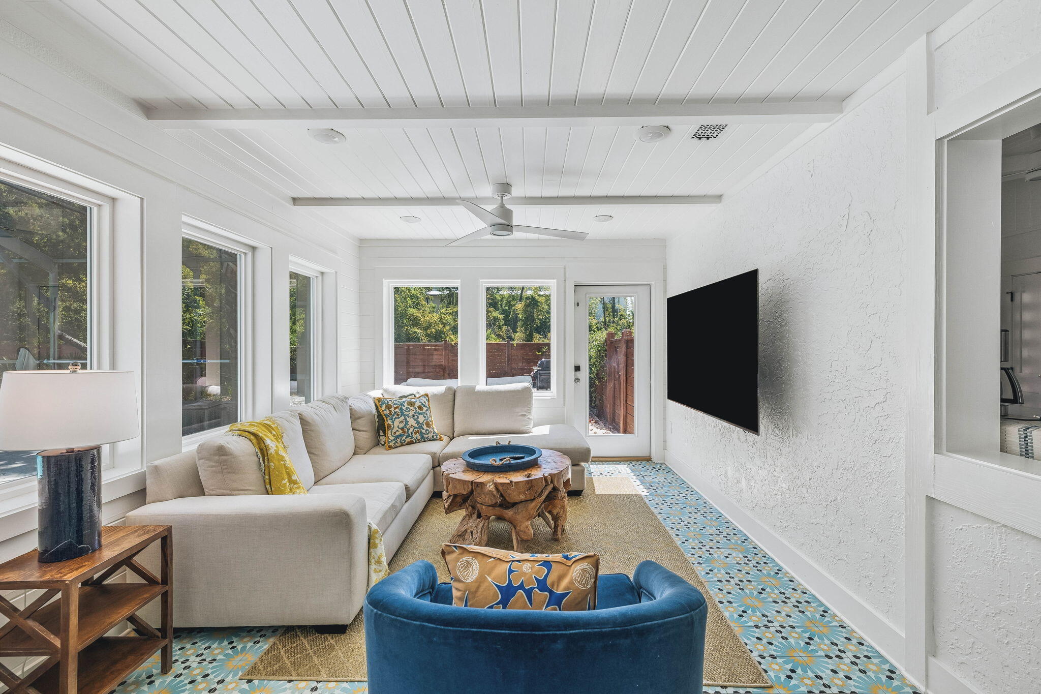 Poised perfectly along 30A in Seacrest, 276 Seacrest Drive presents a rare opportunity to own a beautifully renovated coastal retreat on an expansive 0.32-acre homesite with no HOA. 

Offering the ideal blend of privacy, character, and effortless beach living, this vibrant beach cottage backs to the wooded grounds of Camp Creek Golf Club and is just a short walk from the Gulf and nearby beach access.
Inside, the home embraces a fresh, elevated coastal aesthetic with vibrant vintage-inspired design, distinctive mosaic tile flooring, and an inviting open-concept layout. The beautifully appointed kitchen features marble countertops and backsplash, white and matte-black cabinetry, a wine refrigerator, in-drawer microwave, dishwasher, and full electric range, creating a stylish and functional centerpiece for entertaining. The spacious living area overlooks the pool and opens directly to the backyard, creating a seamless connection between indoor and outdoor living.

Outside, the property truly shines. A large screened-in private pool creates a resort-like setting, complemented by a covered terrace with outdoor dining and grilling, a cozy fire pit, outdoor shower, and full bocce ball court. The fenced backyard provides an exceptional private setting for relaxing, entertaining, and enjoying the laid-back coastal lifestyle. The home includes three bedrooms and two baths, including a private primary suite with ensuite bath, while a dedicated bunk room adds flexibility for guests and family. Four beach cruiser bikes further enhance the home's exceptional walkability and connectivity to everything that makes 30A so desirable. 30A Luxury Vacations
The front of the property is framed by mature oak trees and established landscaping, while the generous homesite provides a level of privacy that is increasingly difficult to find along the 30A corridor. With no HOA, a private pool, substantial lot, wooded backdrop, and convenient access to the beach, dining, shopping, and Camp Creek Golf Club, 276 Seacrest Drive offers an exceptional opportunity to experience 30A on your own terms.
A distinctive coastal property with the space, privacy, and amenities to enjoy as a primary residence, second home, or income-producing vacation retreat.
