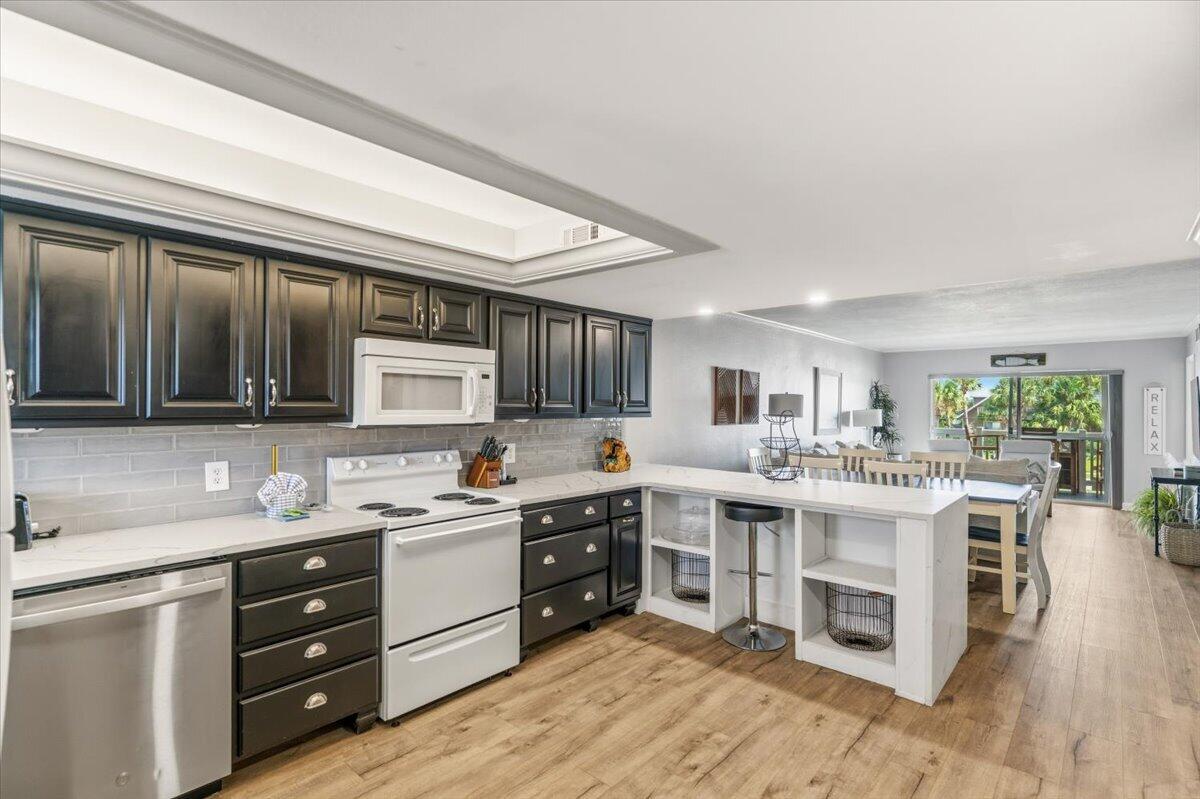 Looking for the unit that needs next to nothing!!! Look no further. From the moment that you walk in the door. You are welcomed by the open,airy and brightness of the space. You see a kitchen full of new cabinets and lots of counter space, where you can cook and still enjoy the company of your family and guest. The dining table seats 6 and looks out into the living room so it can double as a game table for the family night card games too while you still can see the movie in the living room This is where everyone will find room to stretch out and relax after a great day at the beach. Both bedroom are light and bright. The master has a sink just outside the shower/tub room so two can get ready att he same time if needed.
You will find two sliding glass door that lead you out to a large balcony where you can enjoy your morning coffee from either the living room or from the master bedroom. Then again at night to the west you may even be lucky enough to catch a sunset while sipping your evening beverage. This unit can be a perfect home for all time - sometime-or a great investment time...But don't take t much time!!!!! Units like this wont last long.
Call NOW TO SET UP YOUR SHOWING!!!!