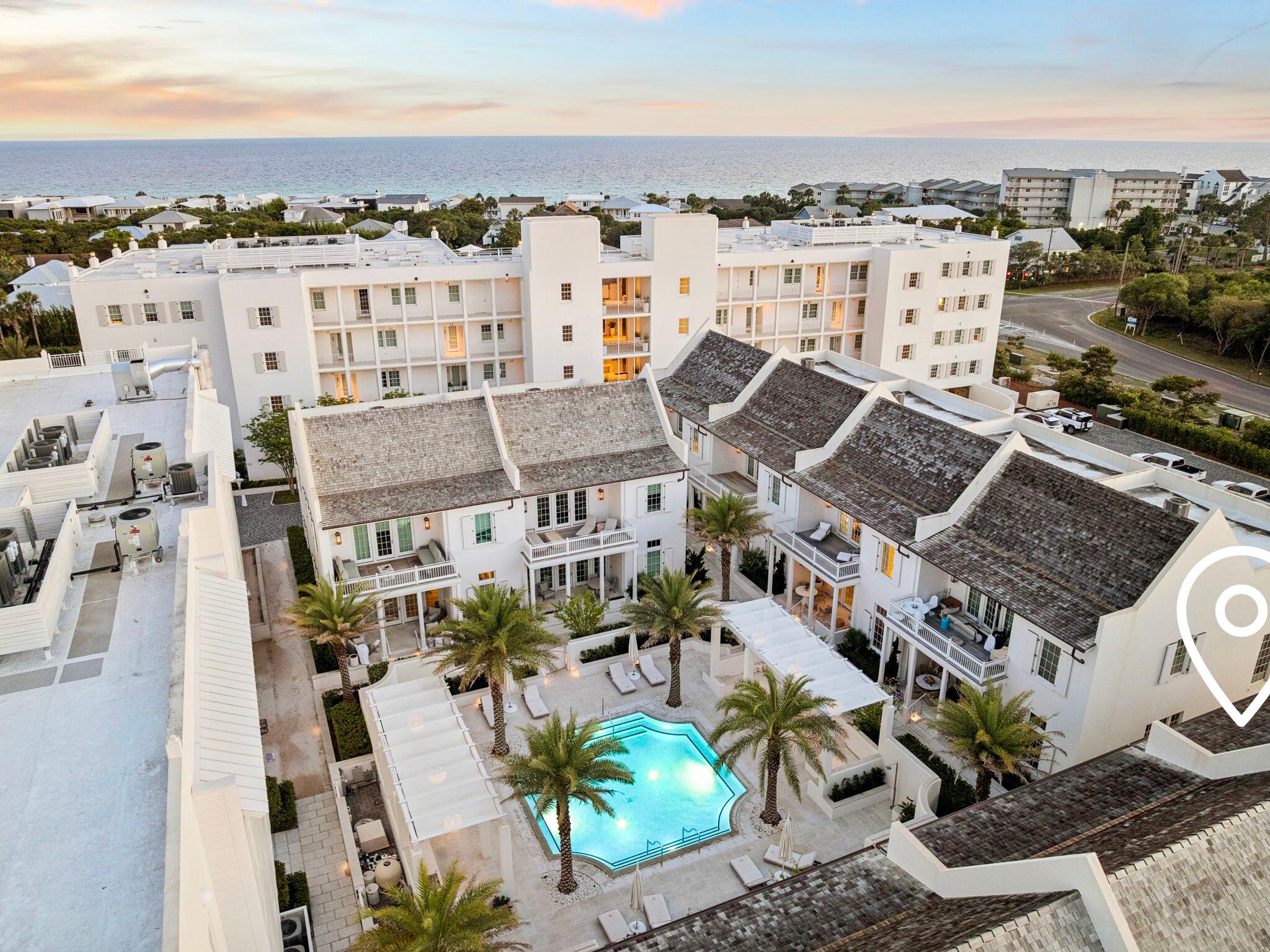 There is one unit at The Mews in Kaiya where the sun sets over the Gulf from your own private balcony. This is it. M7 sits at the western edge, a position no other home in the community shares with open, unobstructed views that greet you every evening. Designed by Khoury-Vogt Architects and built in 2020, the home is 2,496 square feet finished with genuine care. The main level features 11-foot ceilings, large format concrete floors, a kitchen appointed with Sub-Zero, Wolf, and Caesarstone, and a powder room. White oak flooring, Waterworks fixtures, and custom finishes continue upstairs through three bedrooms with three full bathrooms that match the quality of everything below. Nearly 900 square feet of covered terraces extend the living space outdoors which, on 30A, is where life happens anyway. As an end unit, M7 receives natural light from two sides, all day long. It feels quieter and more spacious than its footprint suggests, buffered by a coastal tree canopy to the south and open green space to the east.
The home arrives fully furnished and ready. It is equally suited as a primary residence, a second home, or an income-producing property in one of 30A's most sought after communities. Kaiya's amenities include a Gulf-front infinity pool and concierge beach service, onsite art gallery. Coming soon: 5,000 sq foot spa and fitness center, and Lamuse d'OR café. Alys Beach and Rosemary Beach are minutes away on foot. The 30A bike path begins at the community's edge. There is one west-facing end-unit at The Mews in the Kaiya collection.
This is it. Offered at $3,150,000.