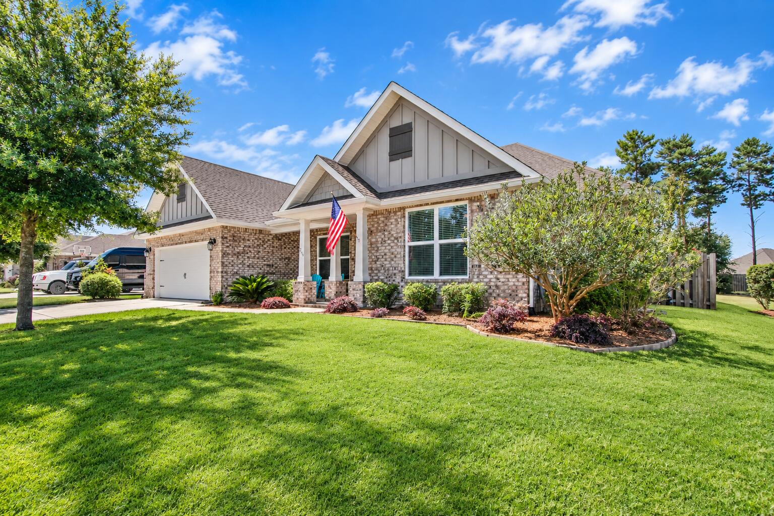 Welcome to 266 Sweet Tea Lane in the highly sought-after Hammock Bay community! This beautifully maintained 5-bedroom, 3-bath Holiday Lilac floor plan offers approximately 2,916 square feet of living space and an extended garage loaded with storage features. Designed for both comfort and entertaining, the home features a spacious screened lanai complete with a Hot Springs spa and a fully equipped outdoor kitchen with granite countertops, gas grill, sink, and mini fridge. The fully fenced backyard is a private retreat with mature fruit trees, blueberries, grapes, and lush landscaping. Inside, you'll find an open-concept layout with a gas fireplace, custom built-in media center, surround sound speakers, and a versatile flex room with French doors that can serve as a 5th bedroom, office, or den. The kitchen features stainless gas appliances, granite countertops, pull-out cabinetry, and a butler's pantry with beverage fridge and wine storage. The spacious primary suite includes a spa-inspired bath with an oversized custom walk-in shower, dual showerheads, built-in bench, and two walk-in closets. Additional upgrades include an extended garage with attic storage, screened garage door, seamless gutters, irrigation enhancements, paver patio, walkways and Tuff Shed. Planty of room to add your pool to this back yard. Enjoy all the amenities Hammock Bay offers, including pools, fitness center, parks, trails, sports courts, and community events, just minutes from Emerald Coast Beaches.