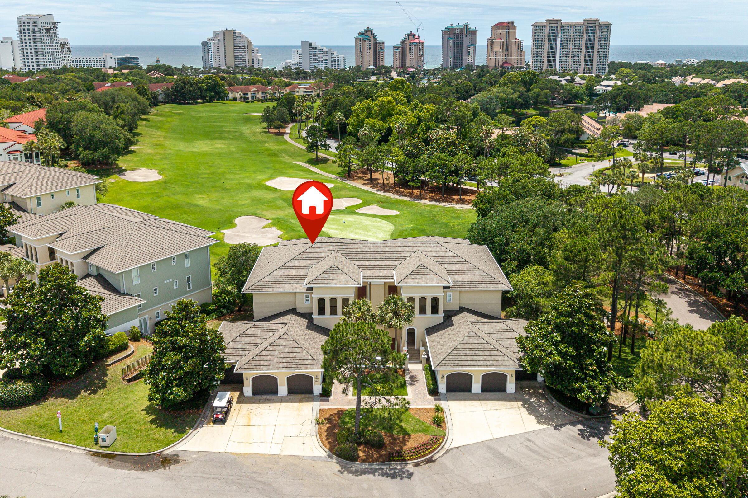 Best-priced large one-level furnished condo in desirable Pine Ridge Villas within Sandestin Golf and Beach Resort! This beautifully upgraded 3BR/3BA rental-capable condo offers panoramic golf course views stretching toward the beach. Perched on one of the highest elevations in the resort, it features travertine marble flooring, 10-ft ceilings, crown molding, and impact-rated French doors and windows. Spacious living area includes a wet bar with granite countertops and a tumbled marble backsplash. The primary suite offers a walk-in closet, double vanities, a separate shower, and a Jacuzzi tub. Includes a 6-seater EasyGo golf cart for convenient resort transportation, a large garage with storage, and a covered entry, and access to heated community pool with cabanas.