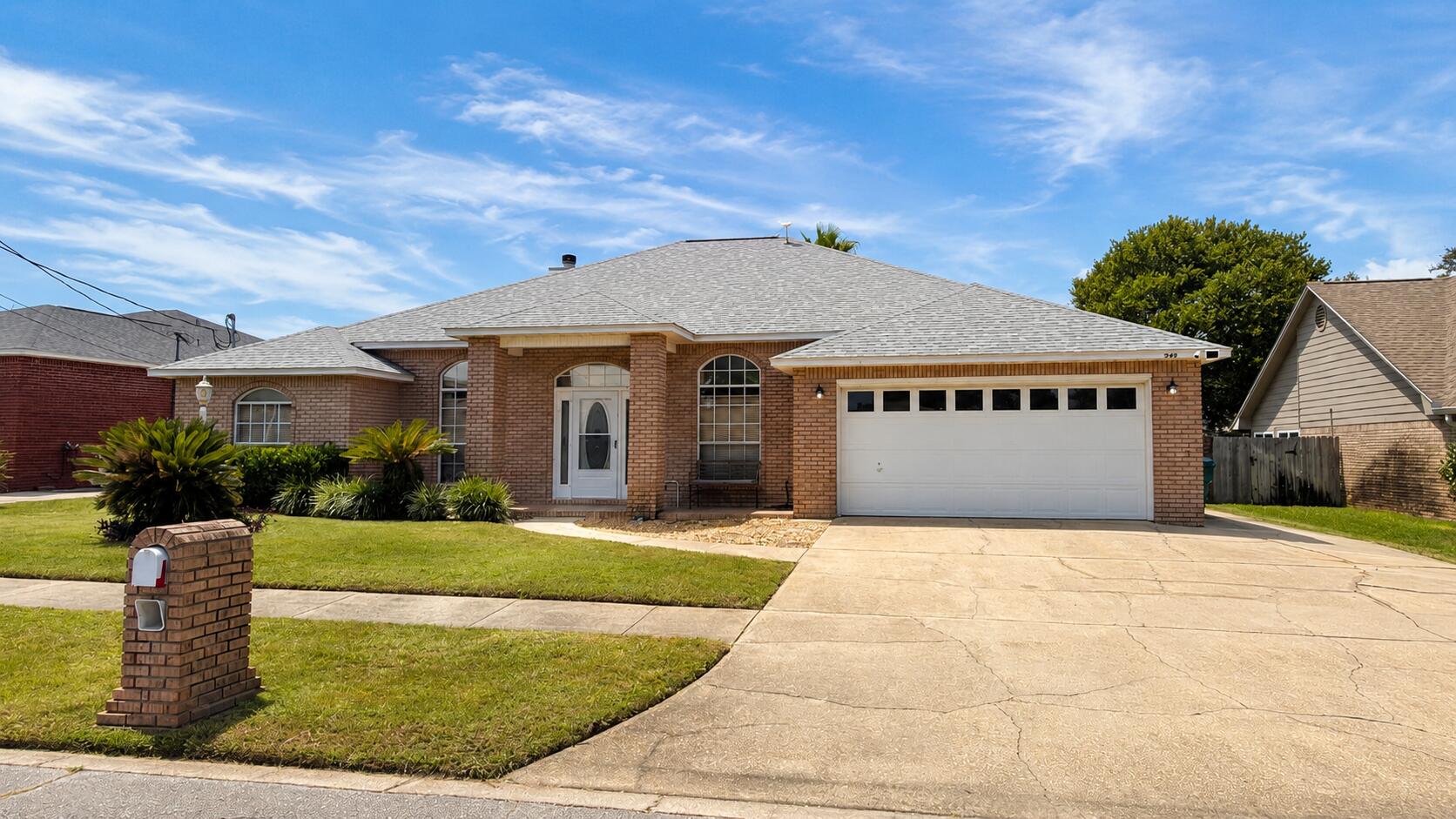 Welcome to 329 Sailfish Circle, a beautifully maintained brick home with a private pool in the heart of Destin! Offering 4 bedrooms plus a separate den/office and three full baths.  This home features a spacious open floor plan with a wood-burning fireplace, formal dining room, eat-in kitchen area, and breakfast bar. The kitchen is equipped with stainless steel appliances and a charming built-in coffee bar with wine storage. The primary suite features tray ceilings, direct access to the pool area, and a spacious bath with separate tub and shower. A convenient exterior-access bath allows guests to come in from the pool without walking through the main living areas. The laundry room includes a utility sink for added functionality. Outdoors, enjoy a private, fully fenced backyard with an inviting in-ground pool and dedicated grilling/entertaining area. The oversized driveway and brick exterior add to the home's curb appeal. Recent major updates include a 2022 roof, 2024 HVAC, and 2019 water heater. Located on a .17-acre lot just down the street from Destin Elementary and convenient to beaches, boating, shopping, dining and everything Destin has to offer. A wonderful opportunity for a primary residence or second home in Destin proper. Buyer to verify dimensions.
