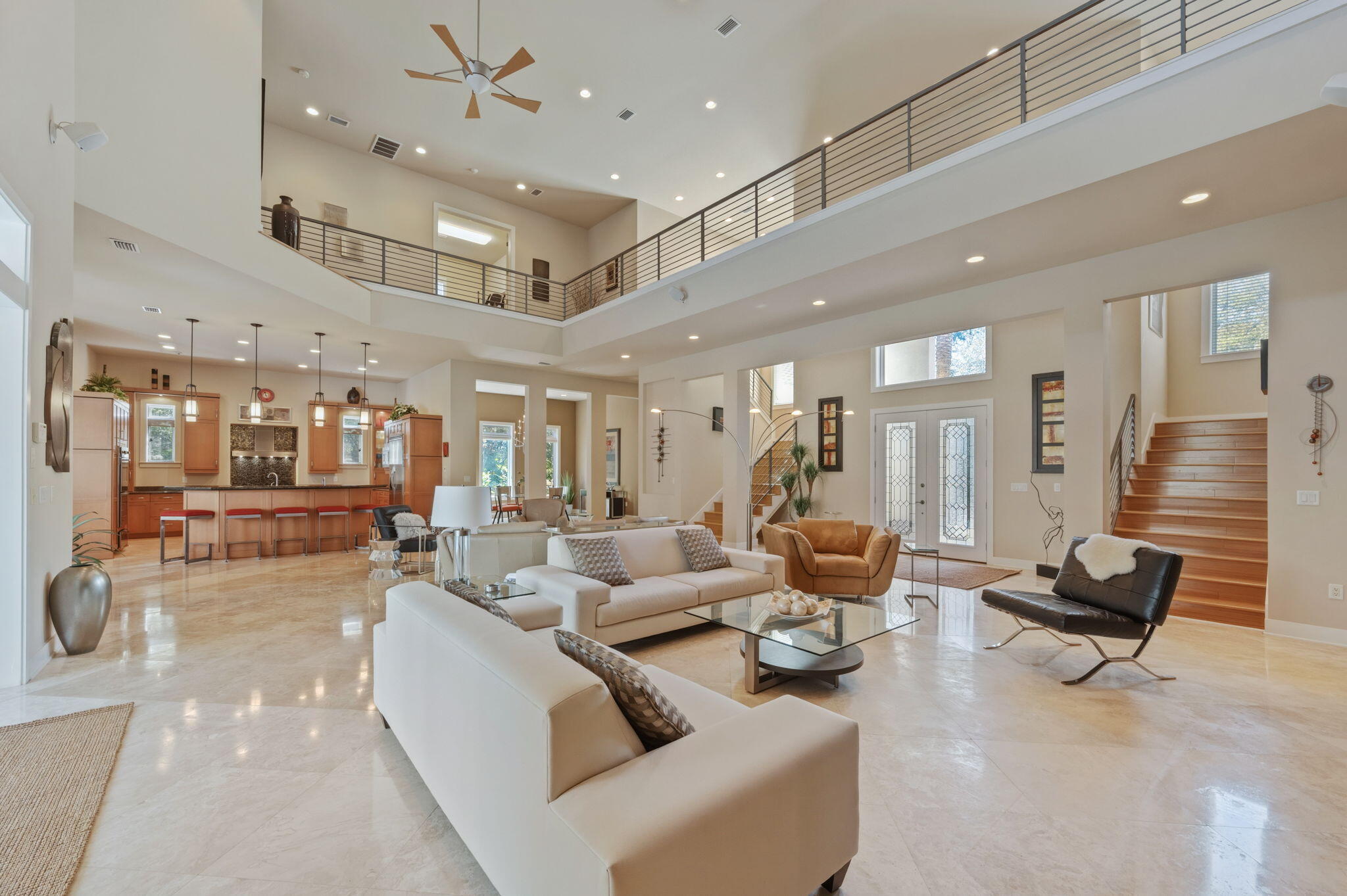 Luxury estate for sale in Burnt Pine at Sandestin Golf and Beach Resort, Miramar Beach, FL -- 6,079 sq ft, 4 bedrooms, 4.5 baths, on a 0.43-acre golf-course lot with lake and fairway views. Built in 2006 in a Mediterranean style, the home offers a first-floor primary suite, soaring ceilings, hardwood and tile flooring, and a gas fireplace in the great room. The kitchen features an oversized island, breakfast nook, and formal dining room, while the second floor adds a media room, second office option, and additional guest bedrooms. A wet bar and sauna round out the entertaining spaces. Parking includes a 3-car garage plus a separate golf cart garage, ideal for full-time Sandestin living. Outdoor living is anchored by a covered, screened pool, heated spa, outdoor kitchen, and outdoor fireplace overlooking the lake and golf course - a private resort setting within the resort. Burnt Pine is one of the few gated Sandestin neighborhoods where short-term rentals are not permitted, offering a true full-time or second-home neighborhood rather than a rotating rental community - a defining feature for buyers searching for privacy on the Emerald Coast. Residents enjoy access to Sandestin's private golf courses, marina, tennis, pickleball, fitness center, and beach amenities.  Located minutes from Miramar Beach and Destin, FL, this home suits buyers seeking luxury real estate near Destin/30A with resort amenities and long-term neighborhood stability. Schedule a private tour today.

Want m kitchen, and outdoor fireplace--ideal for year-round enjoyment.
The first-floor primary suite offers direct pool access and a spa-inspired bath with sauna. Additional main-level features include a private office (optional bedroom), wet bar with ice maker, beverage refrigerator, wine cooler, and a laundry room with dog wash station.
Upstairs, a dramatic catwalk overlooks the main living spaces and leads to multiple guest accommodations, including flexible living areas, a fitness room, and covered balconies with scenic views. Additional highlights include: Three-car garage plus dedicated golf cart garage, Offered fully furnished (with exclusions) Whole-home Cummins generator.  2943 Pine Valley is located in the beautiful Sandestin Golf and Beach Resort which spans over 2,400 acres from the Gulf of Mexico to the Choctawhatchee Bay and offers world-class amenities including: Over 7 miles of beaches and bayfront, Four championship golf courses, 15 tennis courts and fitness center
226-slip marina and full-service spa, Dining, shopping, and entertainment at The Village of Baytowne Wharf, Miles of golf cart, biking, and walking paths throughout the resort. This property presents a rare opportunity to own a luxury home in one of Northwest Florida's most sought-after resort communities--ideal as a primary residence, second home, or investment property.