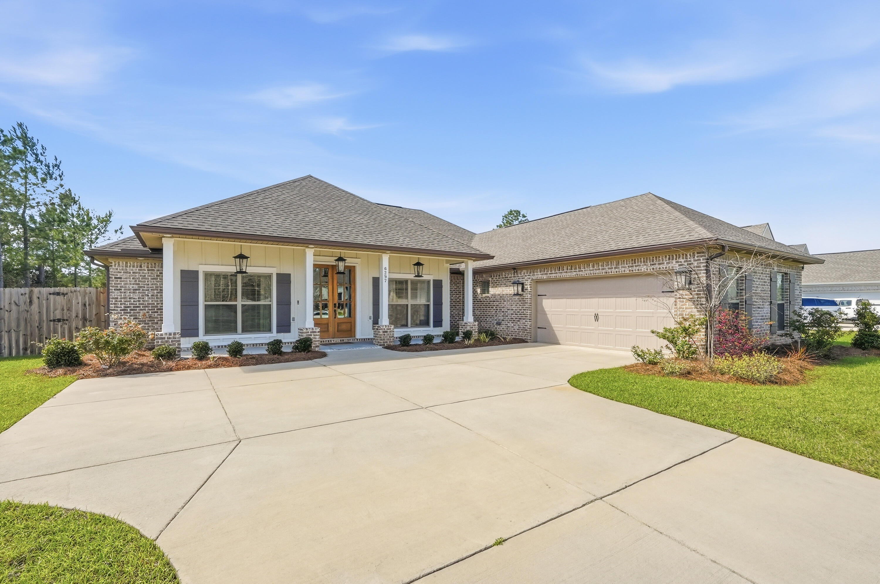 Nestled in Whitley Estates, a well maintained community in the heart of Pace, this home offers a low HOA and convenient access to beaches, shopping, dining, medical facilities, and NAS Whiting Field.

From the moment you step through the custom double mahogany front doors, it is clear that 6297 Howie Way is something special. Meticulously maintained and thoughtfully designed, this 2,540 sq ft, 4 bedroom, 3 bath home with a flex room blends elevated finishes with the warm, unhurried lifestyle that makes Pace one of Northwest Florida's most desirable communities.

The open floor plan feels expansive from the start, anchored by 10 foot ceilings in the living and dining areas and continuous EVP flooring that flows seamlessly through the main living spaces and primary suite.