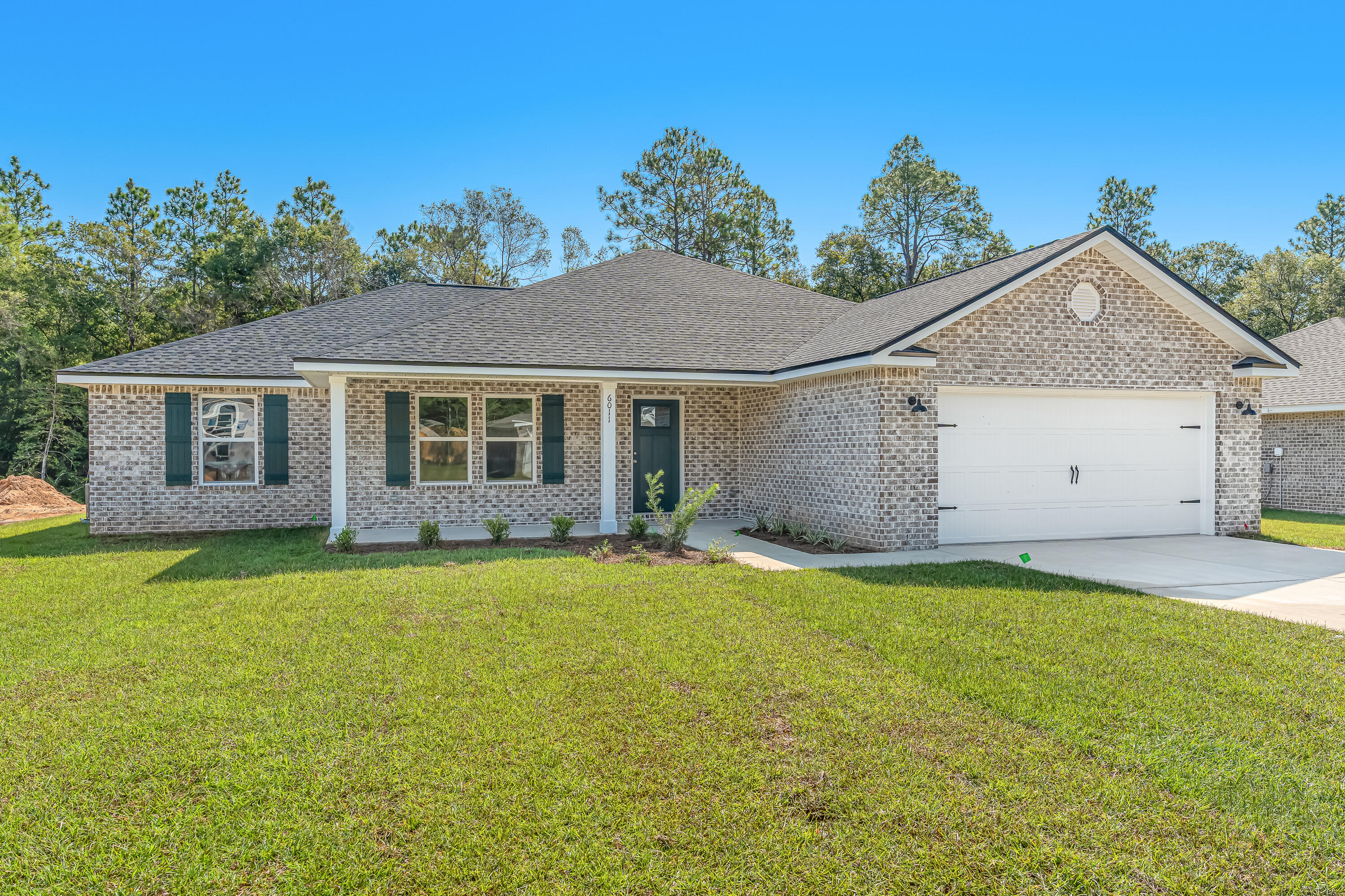 READY IN MID JUNE - 'SIERRA' floor plan is all brick and located on a large lot!!  Plenty of room OUTSIDE for entertaining with covered front and back porches, plenty of room INSIDE for living!!! Raised ceiling entryway leads to family gathering space overlooking kitchen & dining.  Work island has bar seating, pantry and quartz countertops.  Mud room w/space for lockers or freezer + large laundry room.  Owner's suite has double vanities walk-in closet, linen storage and shower.  Additional bath has double vanities & linen storage.  Landscaped yard + finished garage.  SELLER WILL CONTRIBUTE UP TO $12,000 towards buyers closing costs/prepaids/rate buydown (call for details). Photo of similar sold home interior/exterior colors & elevation will vary.