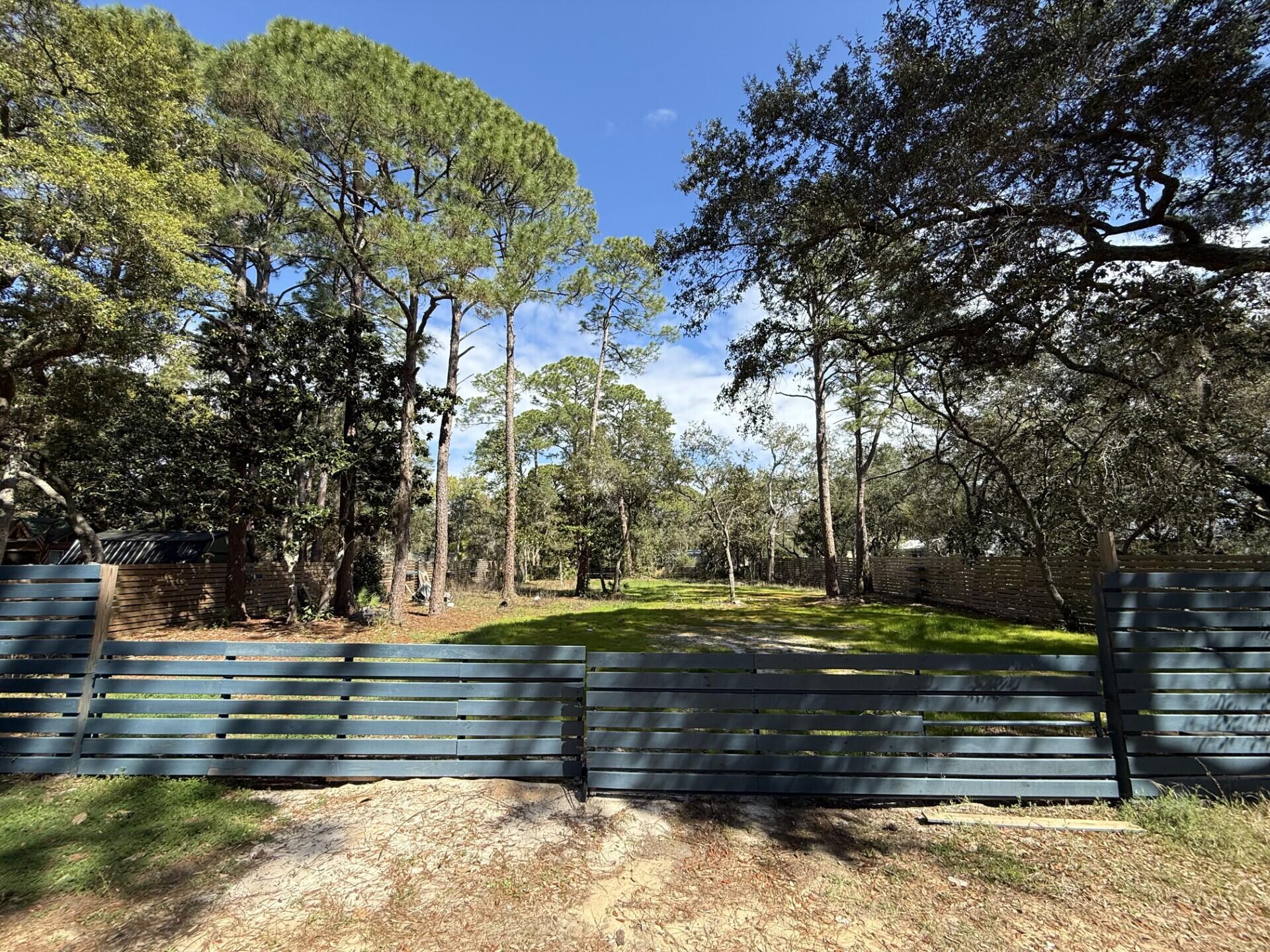 Escape the Ordinary: Your Emerald Coast Dream Starts Here
Imagine a life with no HOA rules, no restrictions--just pure freedom and a canvas of natural Florida beauty waiting for your vision. Nestled in the heart of Santa Rosa Beach, this rare, oversized 0.459-acre lot is enveloped by a majestic canopy of mature trees, offering the perfect blend of absolute privacy and coastal convenience.

Whether you are looking to design your forever custom home, build a high-end spec home, or secure a prime investment property, this land represents a blank slate for your dreams.

The Lifestyle: Where the Bay Meets the Beach
This isn't just a piece of land; it is a gateway to the highly coveted Emerald Coast lifestyle.

Morning Serenity: Take a short, peaceful walk or bike ride to the shores of the Choctawhatchee Bay.

Afternoon Sun: You are just minutes from the world-famous, pure white sugar sands and emerald waters of the Gulf.

Evening Entertainment: Enjoy effortless proximity to Grand Boulevard's upscale dining, Publix, and boutique shopping. The vibrant energy of Sandestin's Village of Baytowne Wharf is right around the corner, offering year-round concerts, fireworks, and family-friendly festivities.

Peace of Mind: World-class healthcare at Ascension Sacred Heart Hospital is only minutes away.

Ready for Your Vision
The groundwork is already laid for you to begin building:

Power Ready: Florida Power & Light (FPL) services the area, and the property is fully prepped for a meter installation.

Modern Amenities: Clean, efficient natural gas is available right in the neighborhood.

Water and sewer tap fees to be paid by Buyer. Seller does not have a wetland assessment report on file.

Don't let this rare opportunity pass you by. Build the life you've always imagined in Santa Rosa Beach.  Call today to claim your slice of Florida living at its absolute finest!

All information and measurements are deemed accurate but should be independently verified by the buyer.