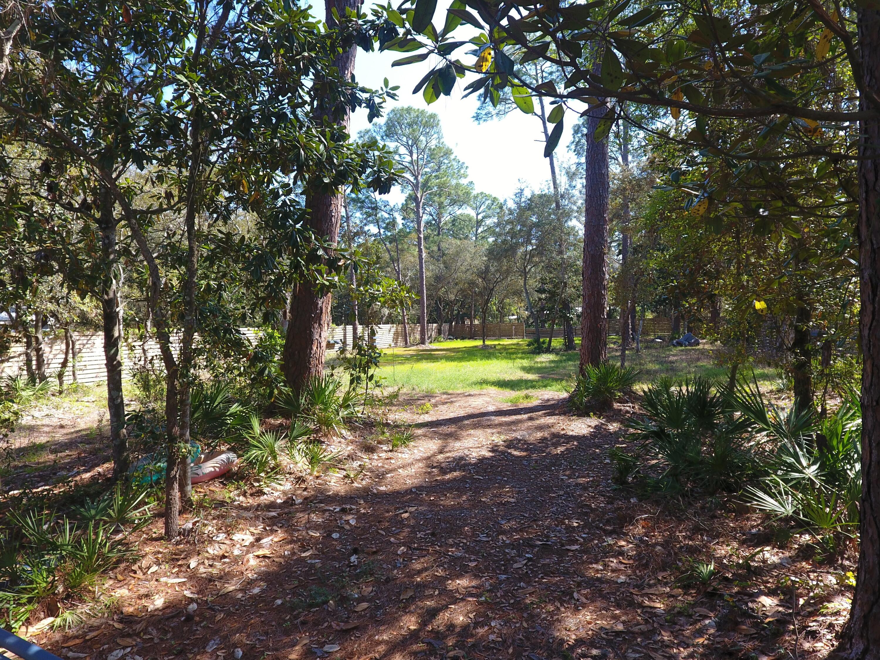 Escape the Ordinary: Your Emerald Coast Dream Starts Here
Imagine a life with no HOA rules, no restrictions--just pure freedom and a canvas of natural Florida beauty waiting for your vision. Nestled in the heart of Santa Rosa Beach, this rare, oversized 0.459-acre lot is enveloped by a majestic canopy of mature trees, offering the perfect blend of absolute privacy and coastal convenience.

Whether you are looking to design your forever custom home, build a high-end spec home, or secure a prime investment property, this land represents a blank slate for your dreams.

The Lifestyle: Where the Bay Meets the Beach
This isn't just a piece of land; it is a gateway to the highly coveted Emerald Coast lifestyle.

Morning Serenity: Take a short, peaceful walk or bike ride to the shores of the Choctawhatchee Bay.

Afternoon Sun: You are just minutes from the world-famous, pure white sugar sands and emerald waters of the Gulf.

Evening Entertainment: Enjoy effortless proximity to Grand Boulevard's upscale dining, Publix, and boutique shopping. The vibrant energy of Sandestin's Village of Baytowne Wharf is right around the corner, offering year-round concerts, fireworks, and family-friendly festivities.

Peace of Mind: World-class healthcare at Ascension Sacred Heart Hospital is only minutes away.

Ready for Your Vision
The groundwork is already laid for you to begin building:

Power Ready: Florida Power & Light (FPL) services the area, and the property is fully prepped for a meter installation.

Modern Amenities: Clean, efficient natural gas is available right in the neighborhood.

Water and sewer tap fees to be paid by Buyer. Seller does not have a wetland assessment report on file.

Don't let this rare opportunity pass you by. Build the life you've always imagined in Santa Rosa Beach.  Call today to claim your slice of Florida living at its absolute finest!

All information and measurements are deemed accurate but should be independently verified by the buyer.