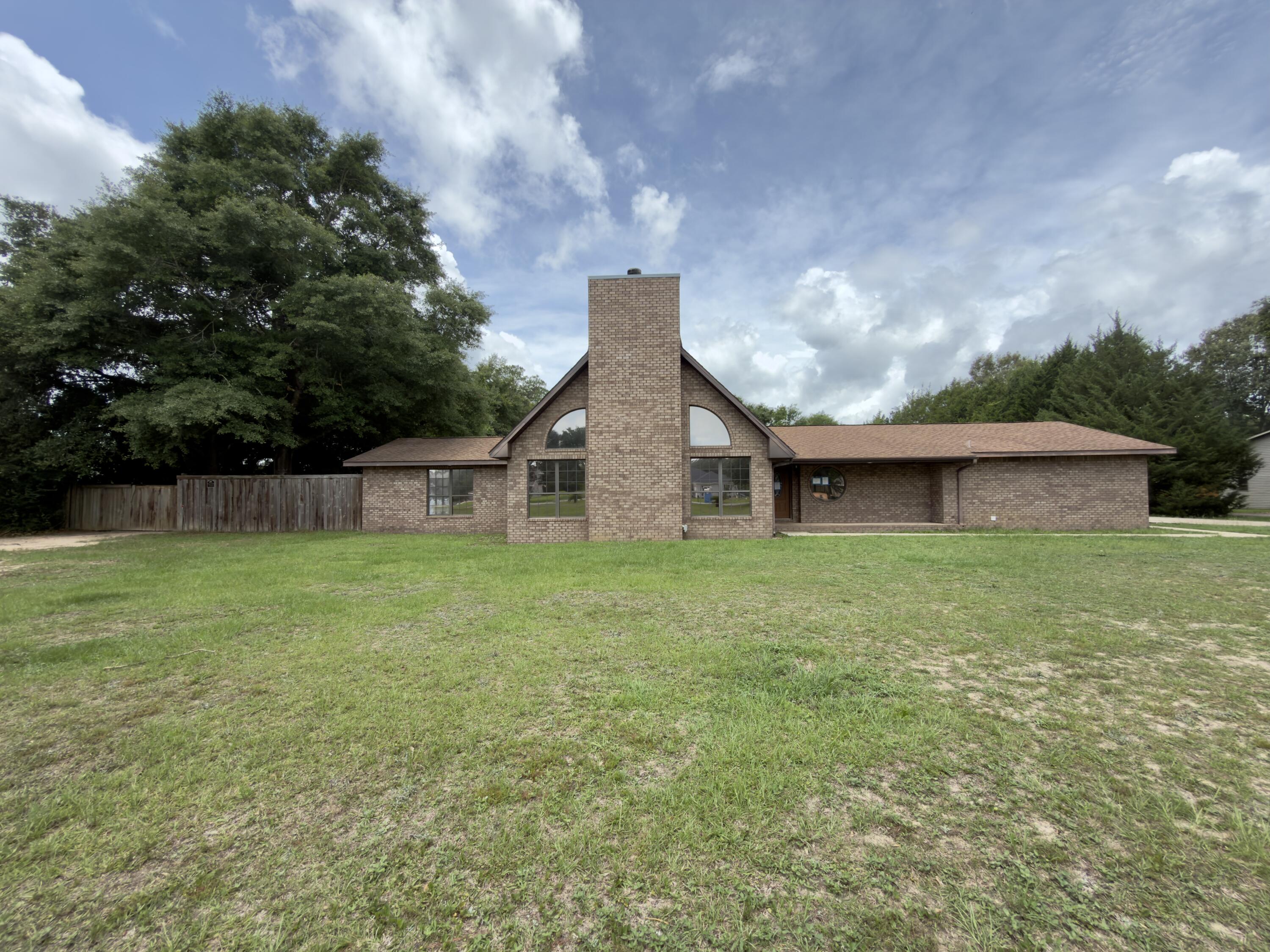 Welcome to your next REO opportunity. There is so much to offer on this property, that this is certainly one must see to appreciate. Originally built in 1984 this huge all brick home rests on 1.78 acres of flat land n the heart of Pace. With a fenced backyard, this home comes with an in-ground pool, pool house with bathroom, and a fully functioning soundproof building, previously used as a recording studio. Inside this home you will find split bedroom design, with a massive master bath suite, upstairs bonus bedroom room, and full bath. Just past the kitchen there is another bedroom along with pantry area, laundry, and additional storage. There is so much to see and a must see to appreciate.