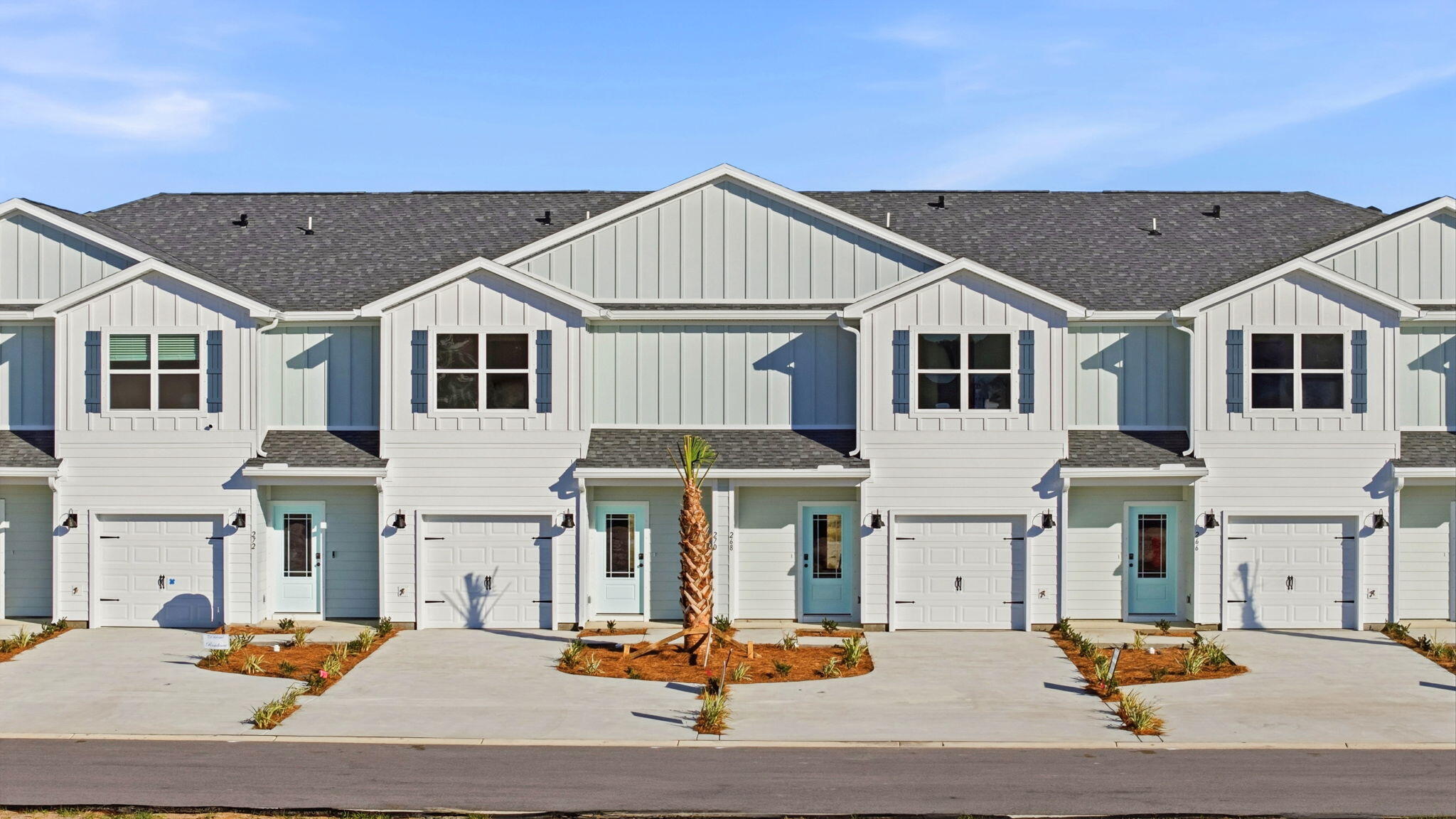 Welcome to 108 Bismark Boulevard Unit 46, a new townhome at Palms Street Townhomes in Destin, Florida. This interior unit townhome is move in ready and is part of a six-townhome building. The interior has an entry hall with EVP flooring leading to an open-concept kitchen, living, and dining area. The open and spacious main level is designed for entertaining and everyday living. The kitchen serves as the culinary center with its spacious center island allowing for easy meal prep and cleanup. This townhome offers interior features such as EVP flooring throughout, quartz countertops in both the kitchen and bathrooms, white cabinetry, and an appliance package that includes a stove, microwave, and dishwasher. The first floor serves as the heart of the home, while the privacy of the second level holds all bedrooms. The main suite is a sanctuary, featuring a generous closet and an ensuite bathroom with a dual sink vanity, tile shower with glass enclosure and a linen storage area. Just down the hall from the primary bedroom are two guest bedrooms. The bedrooms are spacious and have ample closet space. There is a shared bathroom and laundry area off the additional bedrooms.