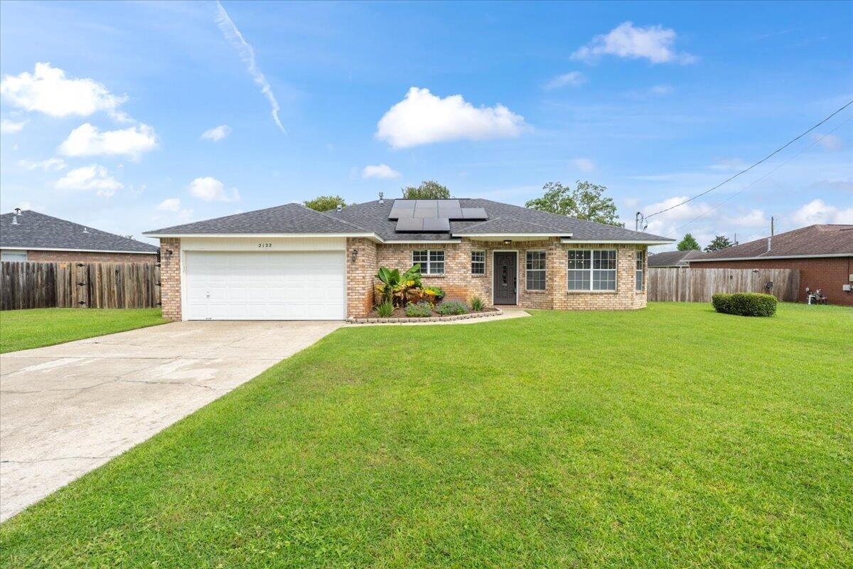 Welcome to this beautifully updated 3-bedroom, 2-bath home offering 1,614 square feet and a convenient location just off Blue Angel Parkway near NAS Pensacola. An assumable VA loan is available (also available for non-military)--please ask your agent to contact us for details! Renovated from top to bottom approximately six years ago (see MLS docs for list of upgrades), this move-in-ready home features thoughtful upgrades throughout, a roof approximately six years old, and FULLY PAID-OFF solar panels for added energy efficiency with no solar loan or lease to assume! Inside, bright recessed lighting, crown molding, and a fresh neutral color palette create a welcoming feel. The kitchen features leathered granite countertops, soft-close cabinetry, Samsung stainless steel appliances, and a full kitchen island with ample cabinet and drawer storage. Updated flooring flows throughout the main living areas, while the bedrooms feature comfortable carpet with upgraded padding. The split floor plan provides added privacy, with the primary suite separated from the additional bedrooms. The updated guest bathroom features a new shower insert, while fresh paint and cohesive finishes complete the clean interior. The backyard also offers plenty of space for boat or RV parking. Conveniently located near NAS Pensacola, shopping, dining, and everyday necessities, the home is also approximately 10 minutes from the Perdido Key area, offering easy access to beaches, boating, dining, and recreation.
