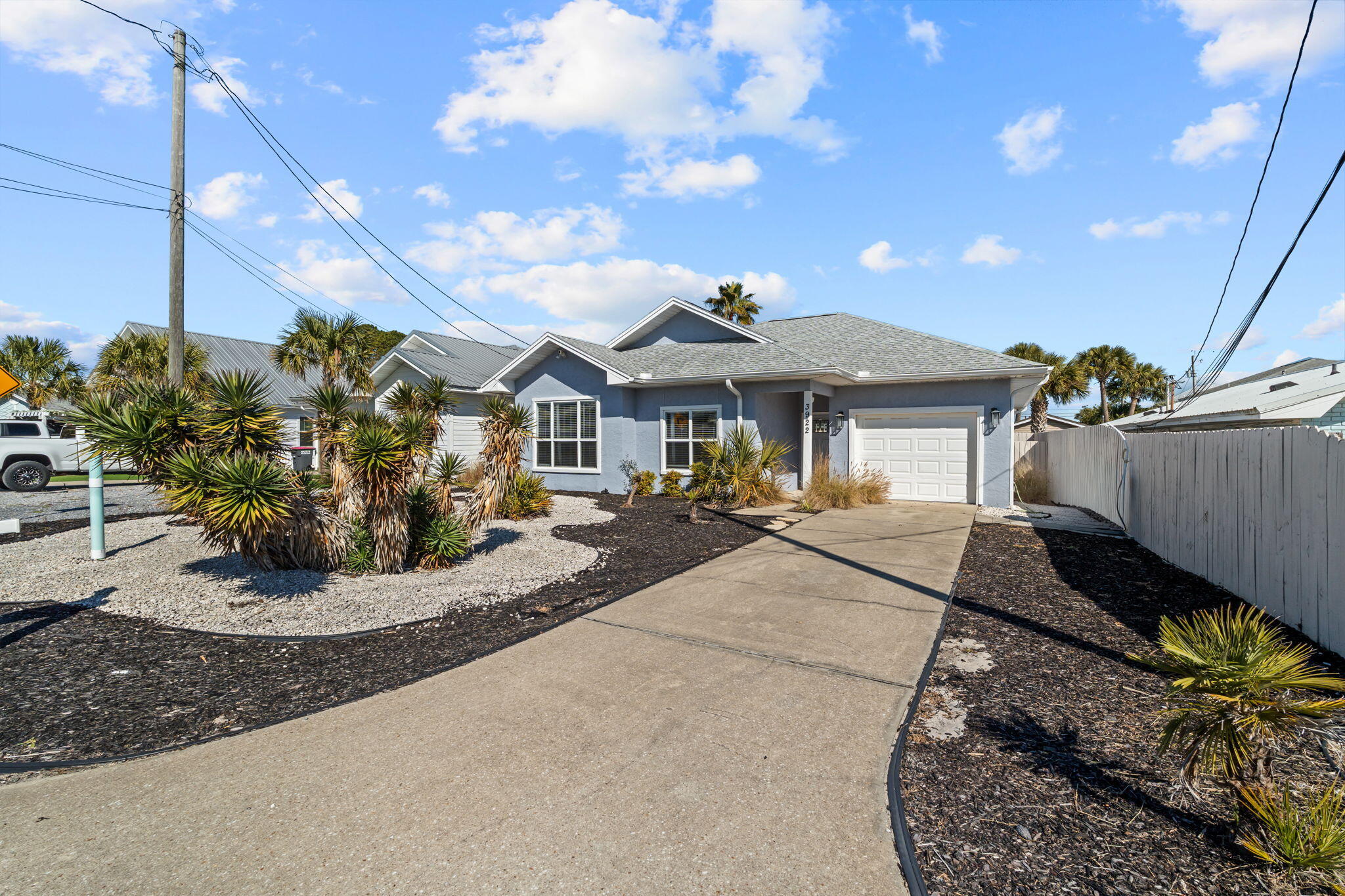 Ideally located just minutes from the sugar-white sands of Panama City Beach, this fully furnished 3-bed, 2-bath home is perfect as a short-term rental investment or personal beach retreat. No HOA and short-term rentals allowed. Conveniently located near Beach Access #16 and Rick Seltzer Park. Inside features a bright open living area with 9' ceilings, durable LVP and tile flooring, and a kitchen with stainless steel appliances stocked for immediate use. Comfortably sleeps 8-10 guests. Additional highlights include a garage with laundry, low-maintenance landscaping, fenced backyard with covered patio, Flood Zone X, and a roof approx. 3 years old. Great opportunity to own close to the beach.