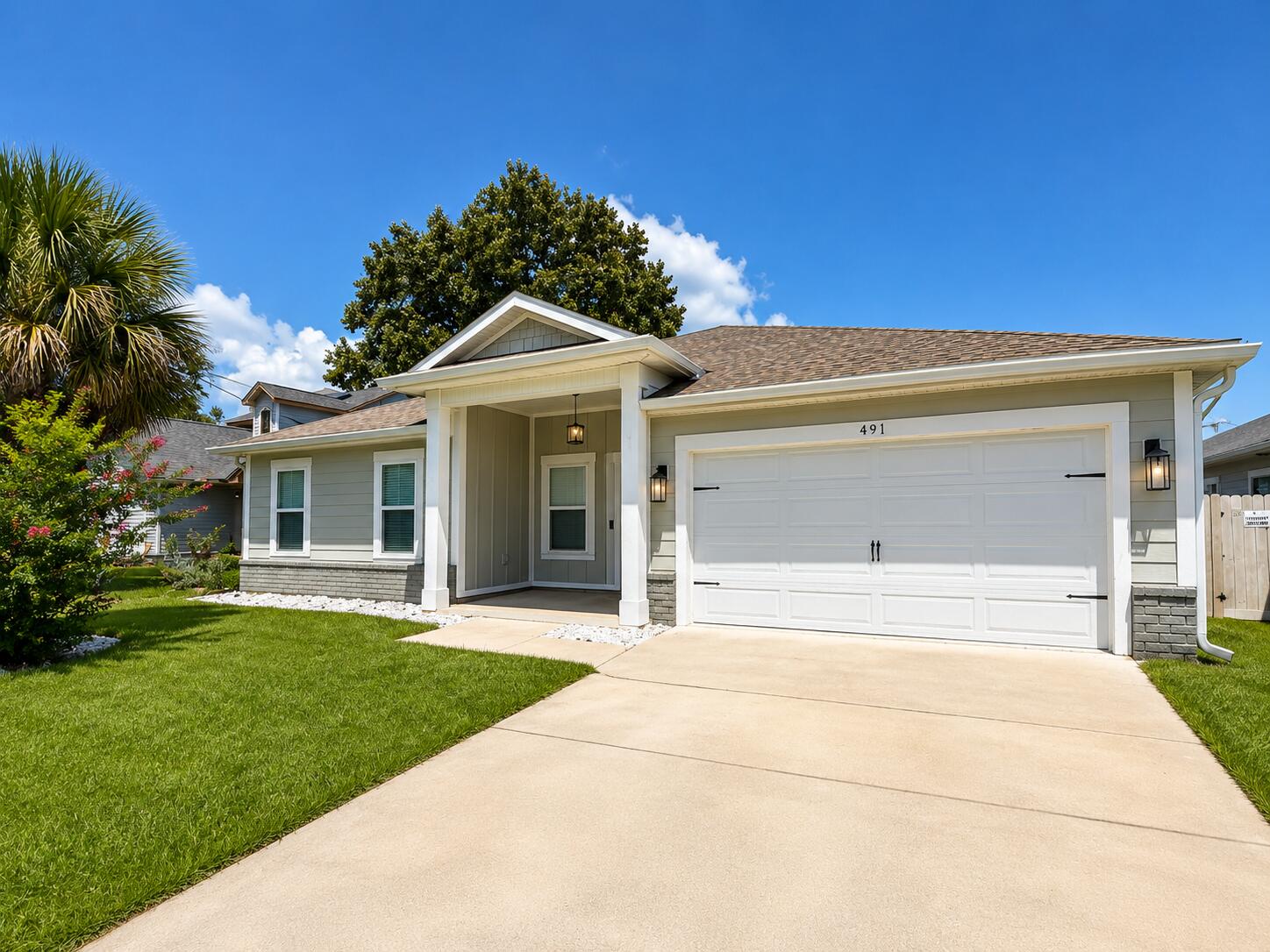 Discover the perfect blend of comfort, style, and convenience in this beautiful 4-bedroom, 2-bath home built in 2020. Located in a desirable Mary Esther community, this well-maintained home offers modern finishes, neutral paint throughout, plenty of closet space, spacious living areas, and an inviting atmosphere that makes you feel right at home. The home also features a 2-car garage and a dedicated laundry room with the washer and dryer included.

The heart of the home is the open-concept kitchen, featuring crisp white cabinetry, granite countertops, a subway tile backsplash, modern pendant lighting, a large center island with a sink, and a walk-in pantry. The kitchen flows naturally into the main living area, creating a bright and functional space for everyday living and entertaining.

The home features durable wood-look flooring throughout the main living spaces and bedrooms, offering a clean, modern look with easy maintenance. The spacious primary suite provides exceptional storage with dual walk-in closets. The primary en suite features a beautiful double vanity with granite countertops, two framed round mirrors, a tiled walk-in shower, and a separate toilet room. The additional guest bedrooms offer comfortable living space, with one guest bedroom featuring its own walk-in closet. A second full bathroom features a tub/shower combination and matching finishes.

Step outside and enjoy Florida living from the large screened-in back porch, complete with a ceiling fan and plenty of room for outdoor seating or entertaining. The screened porch overlooks a fully fenced backyard, providing a comfortable private space to relax, enjoy the sunshine, or make the most of the outdoors.

With its modern finishes, spacious layout, abundant storage, screened outdoor living area, 2-car garage, and convenient location, this home has so much to offer.

Pets may be considered with prior owner approval and a non-refundable pet fee. No smoking is permitted.

Located just minutes from Hurlburt Field, shopping, dining, and the beautiful beaches of Florida's Emerald Coast, 491 Marker Cove offers the lifestyle and location you've been looking for.

Come take a tour and discover why 491 Marker Cove could be your next home!