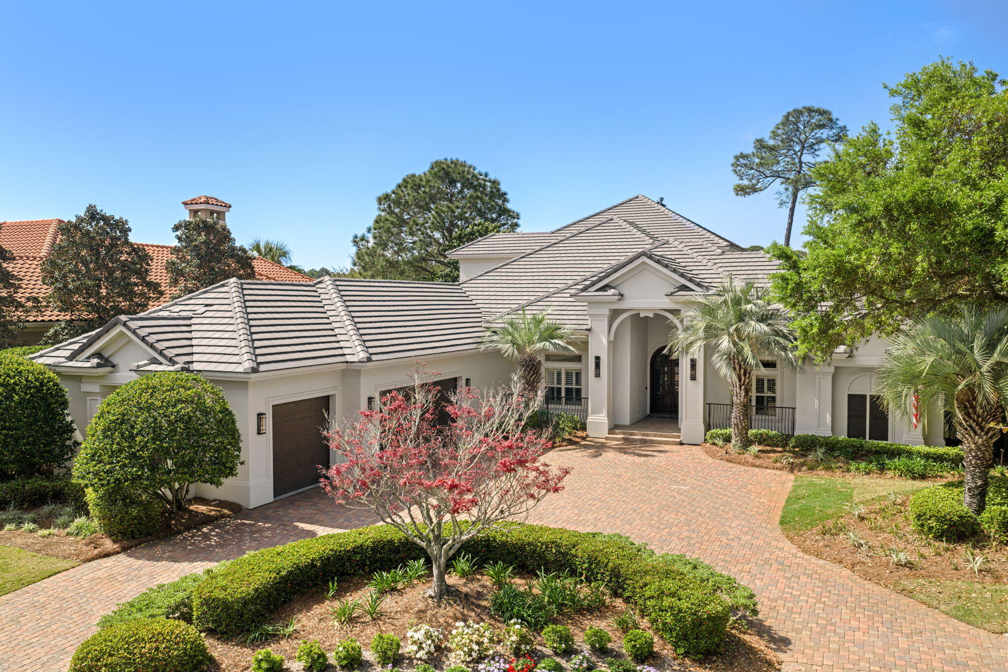 Stunning Boswell Builder's built home offering the perfect combination of a very well thought out and flowing floor plan ,perfect for relaxation and entertaining along with one of the finer golf course lots with lake views in Burnt Pine. This golf course home offers a kitchen that is a chef's dream, featuring double convection ovens; six burner gas stove with pot filler and custom designed hood; plenty of cabinetry; beautiful granite countertops; large kitchen island and Viking refrigerator. The master bedroom, located on the first floor, overlooks the pool and leads into a master dressing room with his and hers walk in closets. The master bath offers double marble vanities, walk-in shower and tub. Also 2 other guest suites on the 1st floor, Bring the outside in with over 2,200 sq.ft. of screened Lanai that contains a sparkling pool accompanied with waterfall; outdoor kitchen; fireplace with TV alcove and plenty of covered room for seating, and enjoying views of the golf course. The guest quarters, on the second floor, is equipped with a bedroom, full bath, bonus room and a covered balcony running the length of the home for even more capturing views of the golf course. Additional appointments to this beautiful home are many built ins; extensive crown molding; plantation shutters; extra storage areas above garage and off of bonus room; office with built-in cabinetry, wine room with wine cooler, racks and wrought iron door; crown molding throughout; Travertine floors; elegant dining room; den; living room; powder room, laundry/craft room and 3 car garage. Come and see this home. It will certainly please.