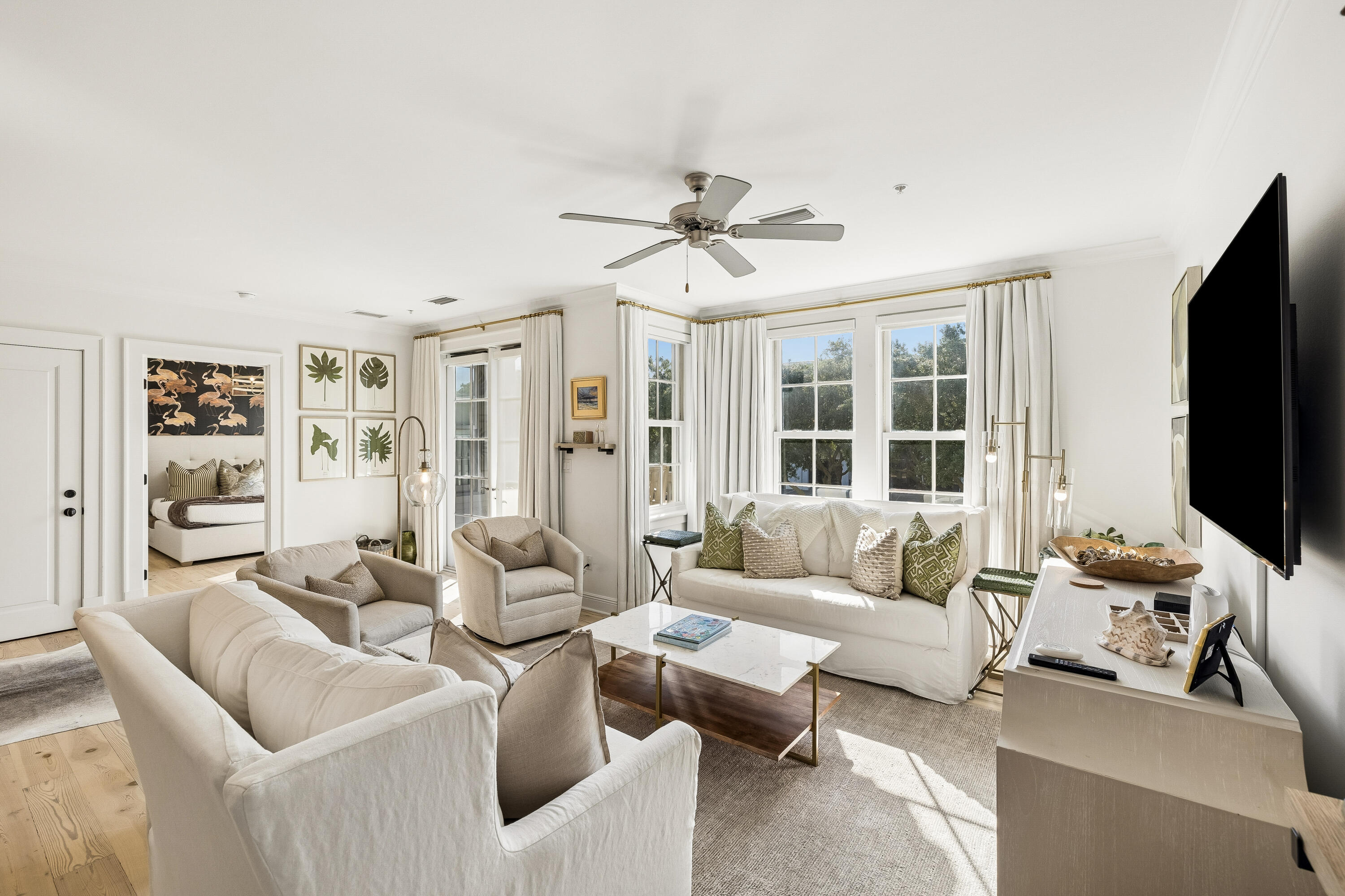 Experience the pinnacle of refined coastal living in this exceptional residence overlooking the vibrant energy of Barrett Square in the heart of Rosemary Beach. Thoughtfully curated with timeless architecture, impeccable craftsmanship, and sophisticated designer finishes, this elegant retreat seamlessly blends the relaxed charm of Scenic Highway 30A with the comforts of luxury living.

Warm whitewashed pecky cypress walls, rich hardwood flooring, and custom built-ins create an inviting yet elevated aesthetic, while expansive living and dining spaces are designed for both intimate gatherings and effortless entertaining. At the heart of the home, the stunning Italian-designed kitchen showcases sleek custom cabinetry, premium Wolf and Sub-Zero appliances, and exquisite attention to detail, delivering both beauty and exceptional functionality. 

The intelligently designed floor plan offers privacy for owners and guests alike, with each of the three spacious bedroom suites occupying its own private wing. Luxurious marble-appointed bathrooms provide spa-inspired accommodations, while private balconies overlook the iconic architecture, lively cafés, and charming streetscape of Barrett Square, placing the very best of Rosemary Beach just outside your door. Perfectly positioned within one of 30A's most coveted destinations, residents enjoy immediate access to award-winning restaurants, boutique shopping, owners' events, and the community's world-class amenities, including multiple resort-style pools, private beach access, fitness facilities, tennis and pickleball courts, and miles of scenic walking paths. Just moments from the sugar-white sands and emerald waters of the Gulf of Mexico, this extraordinary residence offers an unparalleled opportunity to embrace the Rosemary Beach lifestyle, where timeless coastal elegance, walkable convenience, and effortless luxury converge.
