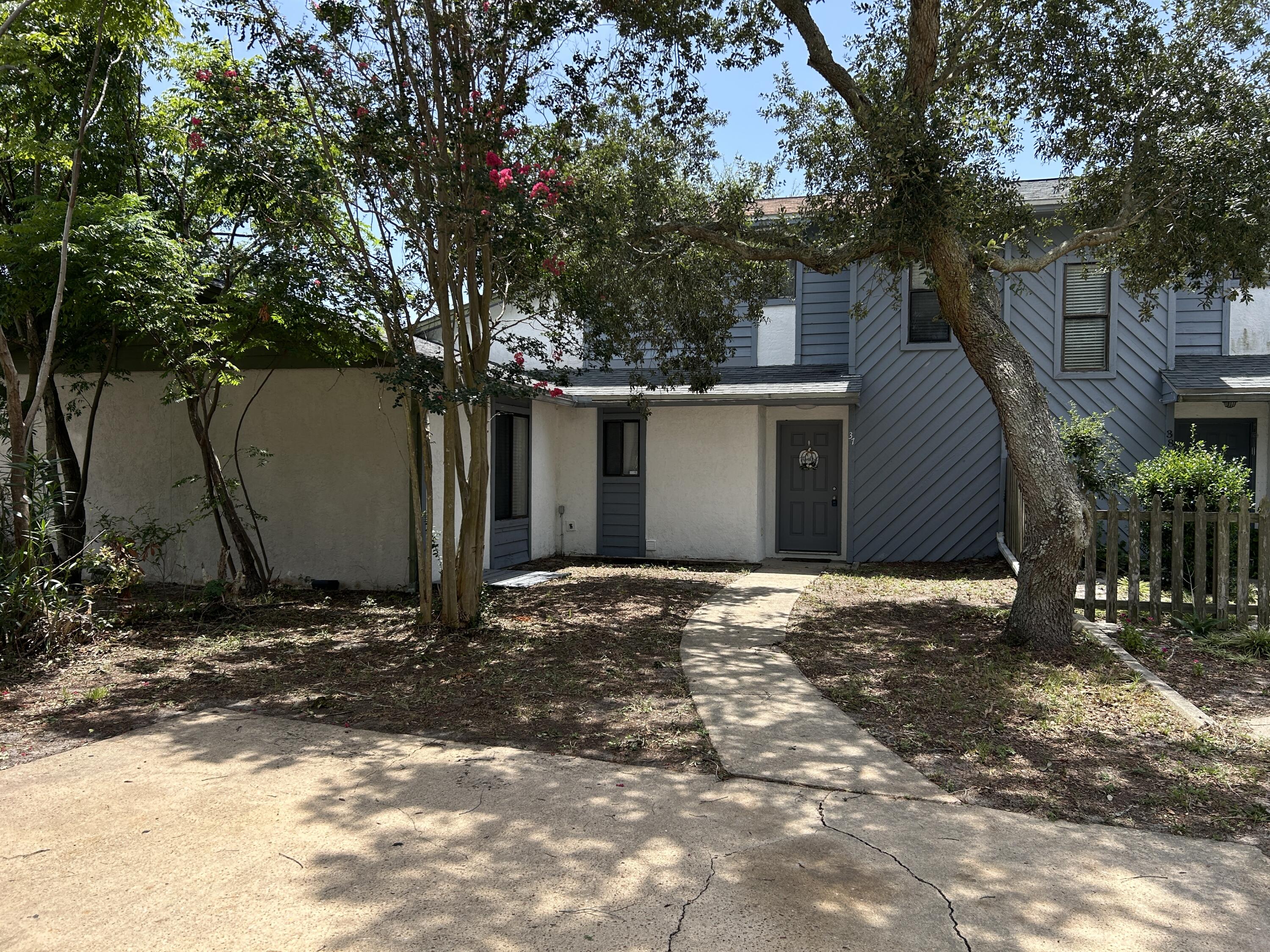 Whether you're looking for your first home, a beach getaway, or an investment property, this centrally located Destin townhouse is one of the best opportunities to get into one of Florida's most sought-after beach communities--with NO HOA FEES. This 2-LARGE BEDROOM, 1.5-BATH TOWNHOUSE offers the freedom and flexibility that's becoming increasingly hard to find. The home features STAINLESS STEEL APPLIANCES, updated bathroom vanities, a FULLY FENCED BACKYARD that's perfect for pets or entertaining, and a SPACIOUS FRONT YARD with a beautiful oak tree that creates the ideal spot for a garden or shaded sitting area. The home provides a solid foundation and an affordable entry point into the Destin market. Location is where this property truly shines. You're just minutes from Destin's sugar-white beaches, the Harbor District, shopping, restaurants, medical facilities, and Destin Elementary School. The new Publix is nearby, and Main Street Park's waterfront green space is just around the corner. Don't miss one of the few opportunities to own an affordable home in the heart of Destin with no HOA. Schedule your private showing today and see the potential for yourself.