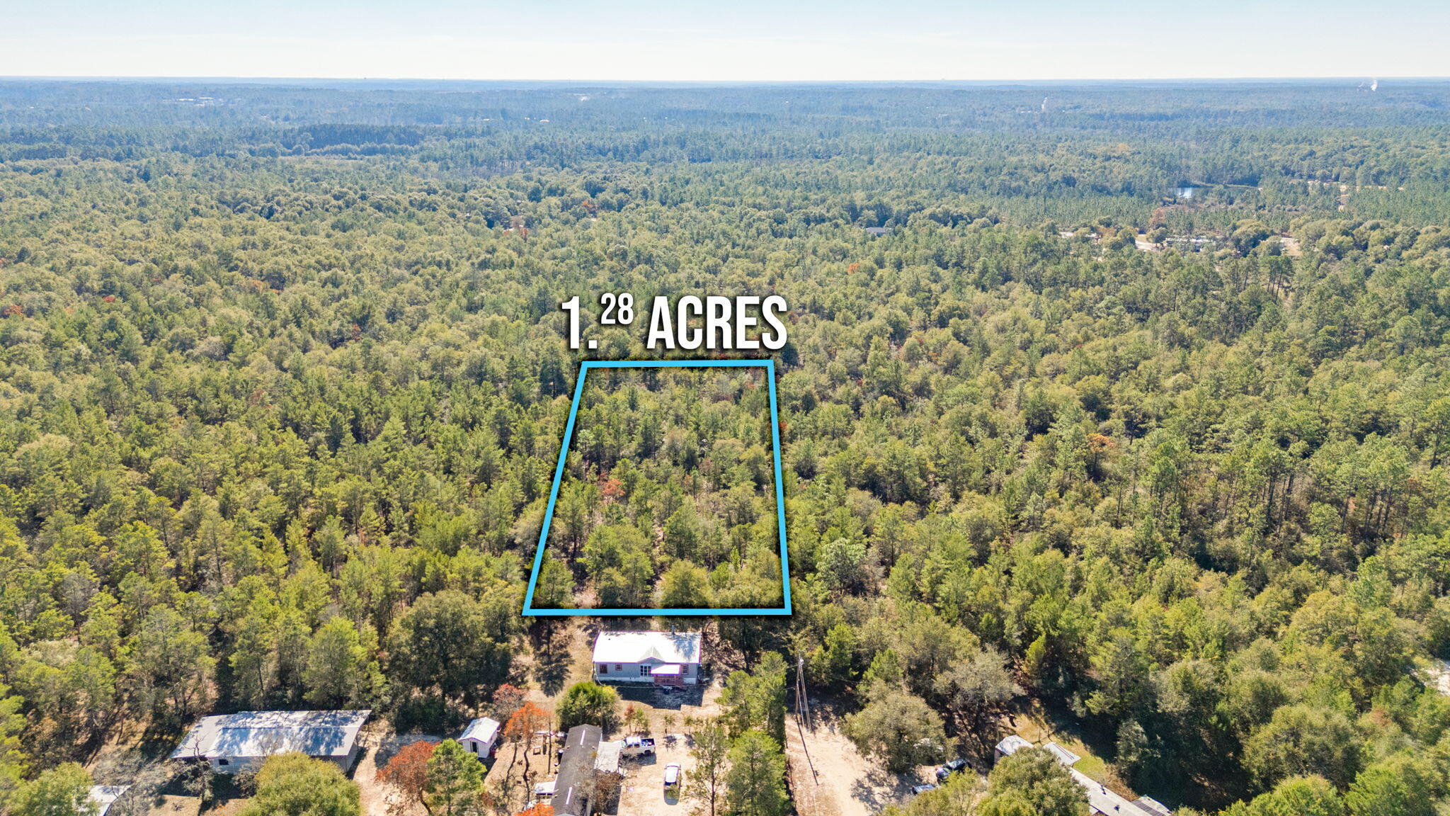This 1.28 acre lot is in a great location near Lake Holley and very convenient to town. It is wooded offering an abundance of privacy and ready for you to make it your own with no HOA and no restrictions. Mobile homes are allowed. The property does have access to public water and sewer. There is a current survey available!