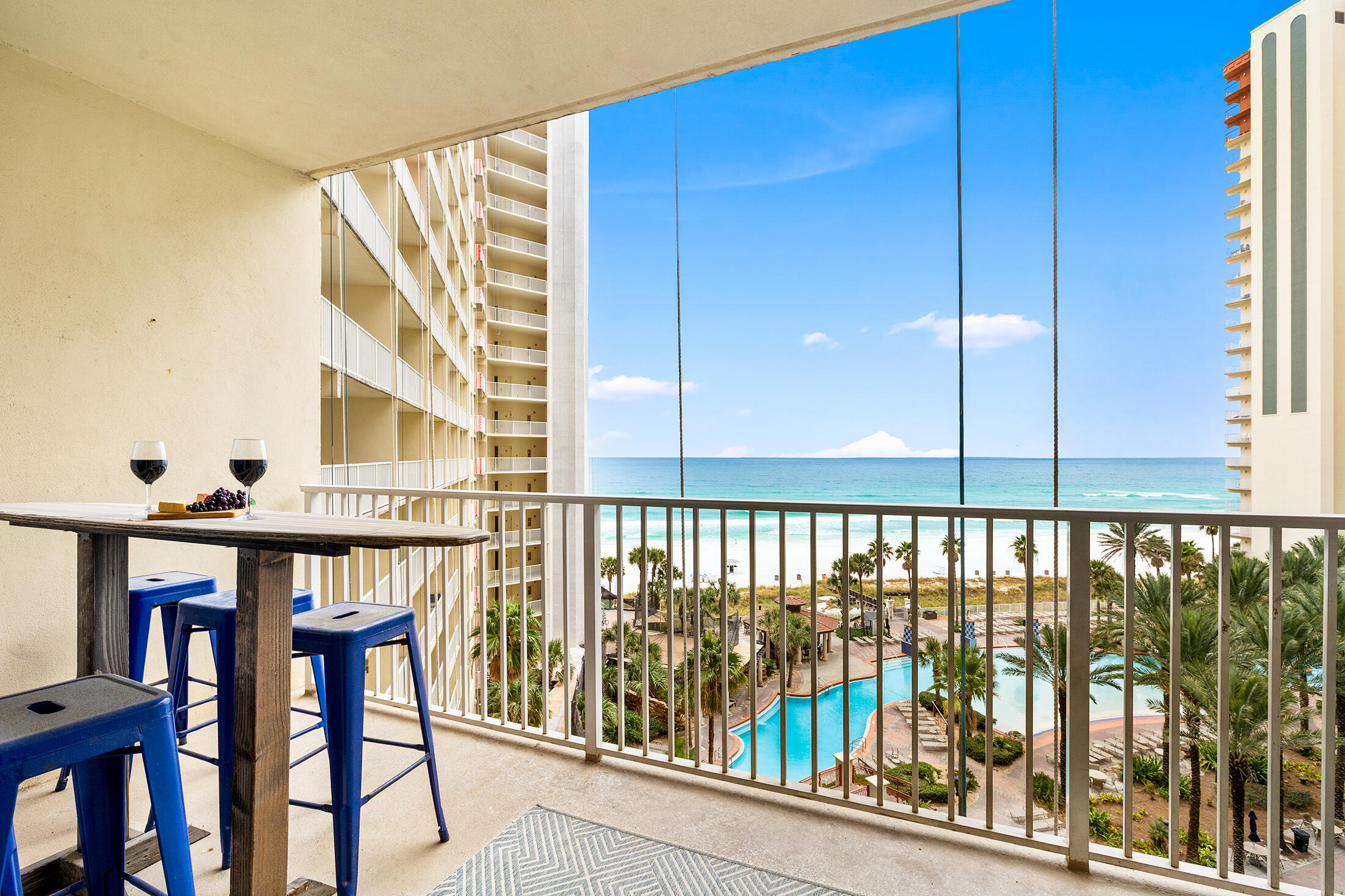 Beautifully updated and fully furnished 2BR + bunkroom/3BA condo at Shores of Panama. Unit 721 sleeps 8 and features two private en-suite bedrooms plus a separate bunk room with its own full bath. Rare same-level ASSIGNED PARKING means no elevator hassle! Gulf views from the living area and kitchen, tile flooring throughout, and turnkey coastal décor. A/C and water heater approx. 5 years old. Resort amenities include 500' Gulf frontage, lagoon pool, indoor pool, hot tubs, fitness center, bars, food service, and 24/7 security. Conveniently located near Pineapple Willy's, shopping, dining, and attractions. Great primary, second home, or rental investment opportunity!
