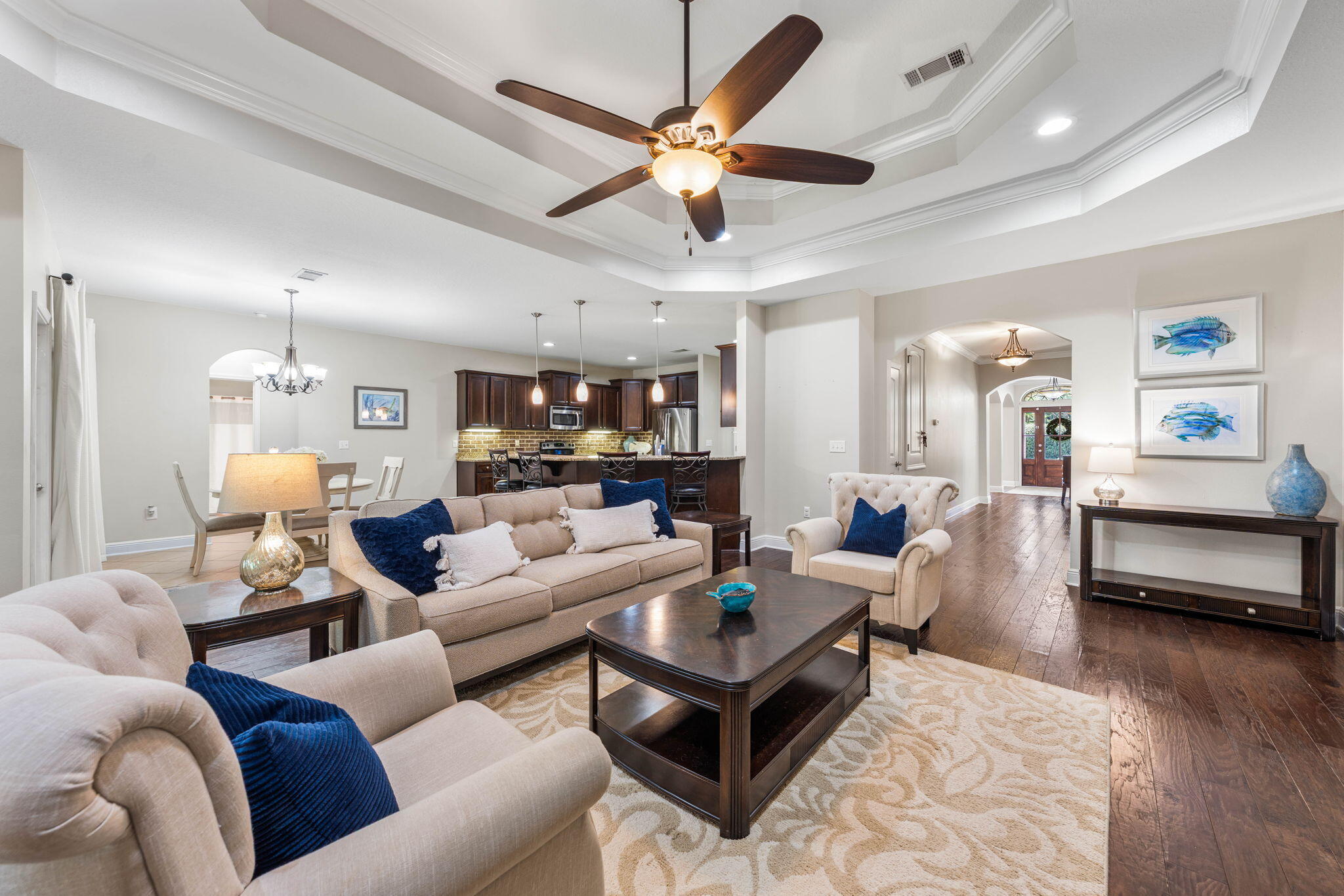 Wake up, load the boat, and be at Crab Island in minutes. Set on 82.5 ft of Mussett Bayou with a private dock and boat slip, this single-story home delivers direct access to Choctawhatchee Bay via Hogtown Bayou--spend the day on the water and return straight home, all from behind the gates of a private neighborhood. The 5-bedroom, one-level layout includes a dedicated office/study, giving room to host, work from home, and give guests their own space--all without sacrificing privacy, thanks to a smart split-bedroom design. Positioned at the end of a quiet cul-de-sac and backing to a protected conservation area, the setting feels private and removed. A raised walkway leads from the backyard through the preserve to the water, creating a unique, buffered connection to your dock. Inside, the open layout features a spacious kitchen with granite countertops, stainless appliances, wine cooler, and oversized island flowing into the main living area and screened lanai. The primary suite sits at the rear with direct lanai access and a spa-style bath featuring a jetted tub, tiled shower, dual vanities, and a large walk-in closet. For buyers who want the boating lifestyle without giving up privacy or space, this single-story property offers a rare balance within Mussett Bayou Estates.
