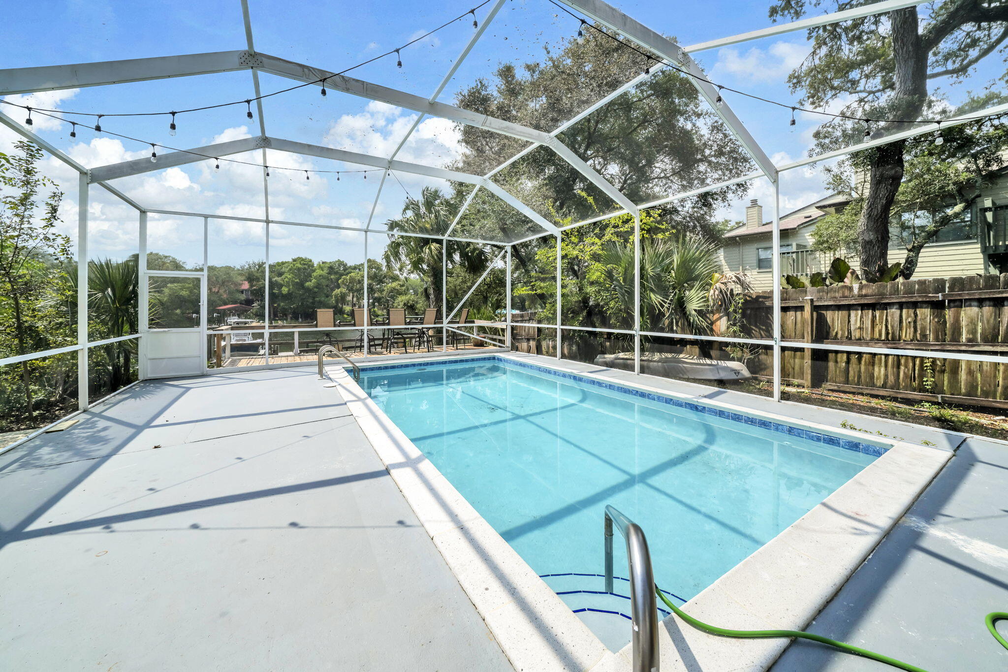 Waterfront living awaits in this all-brick 3-bedroom, 2-bath home on protected deep water in the no-wake zone of Kidd Bayou. Step outside to your backyard oasis featuring a newly refinished gunite pool with a brand-new tile border, screened lanai, and four spacious decks overlooking the bayou. Perfect for entertaining or relaxing by the water!!

Inside, the open floor plan is designed to maximize the views. The living room features a cozy electric fireplace, while the dining area overlooks the backyard, creating the perfect setting for everyday meals and entertaining. The kitchen offers granite countertops, updated appliances, a gas range, and tile flooring throughout the home. The primary suite is a peaceful retreat with its own private deck overlooking the pool and bayou--the perfect spot to enjoy your morning coffee or unwind at the end of the day.

Recent updates include a new dock (2024), boat lift motor and electrical (2023), remodeled primary bathroom (2023), interior paint (2023), pool pump (2024), newly refinished gunite pool with new tile border (2026), refrigerator (2025), garage door opener (2025), and lanai screens and doors (2025).

Conveniently located just off Yacht Club Road, this move-in ready waterfront home offers the perfect blend of boating, entertaining, and everyday living.