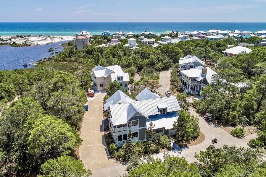 Presenting one of the last and largest homesites in the private, gated community of Draper Lake Coastal Village. At .22 acres, this expansive parcel stands out in one of 30A's most architecturally celebrated neighborhoods—offering the rare combination of size and privacy. House plans are to be approved by the HOA approval board.

Thoughtfully sited along Wild Cherry Lane, the property conveys with plans for a two-story, coastal-craftsman residence encompassing approximately 3,551 sq ft total (with 2,895 sq ft conditioned) and a detached guest house with garage. The design captures the essence of Draper Lake living—organic materials, generous porches, and refined architectural detail throughout.