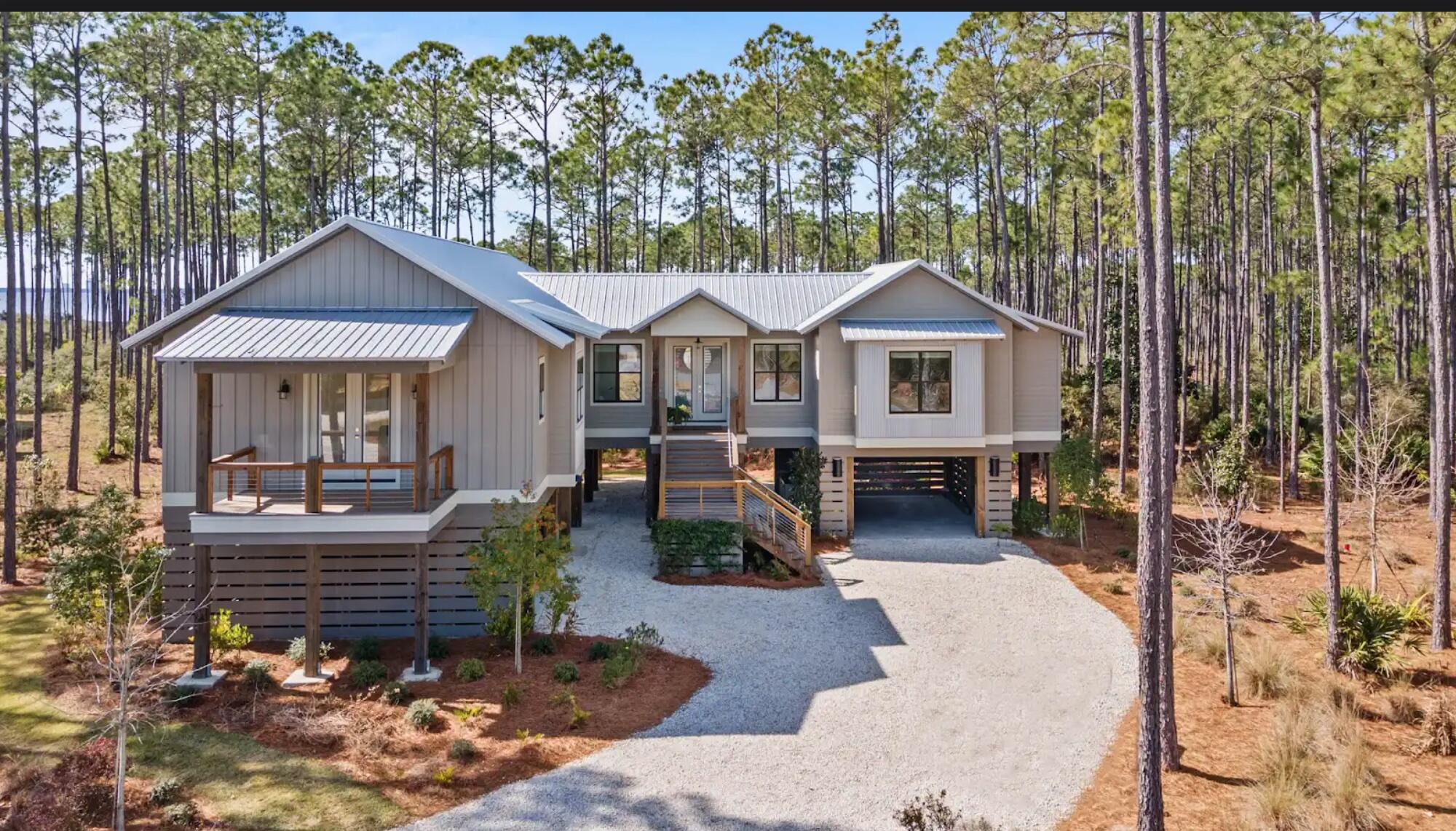 1.1  Acres Incredible Forever Views. Modern home with outstanding finishes and Wolff Appliances (stove and fridge)
If space, nature and great forever bay views  are your thing welcome to your home paradise. 

What is the point  living in the most beautiful community in the state if you are not going to enjoy breathtaking  views all the time to help you forget about the mortgage payment. 

This home is arbitrarily the BEST built home in River Camps, meticulously crafted  construction sits on a 1.1-acre lot with stunning views of West Bay.

Furniture, golf cart and day swing on the grand back porch for additional 25k just pack a suitcase and move in.

Furniture, golf cart and grand porch swing RiverCamps has a boat launch with direct water access to Crooked Creek, West Bay, and the Gulf of Mexico-offering unmatched access to some of the area's most scenic waterways. Boat to Uncle Ernie's Restaurant and Shell Island in 15-30 minutes! if you have a speedboat
Enjoy kayaking, paddleboarding, fishing, or simply enjoy water views from your living room. This gated, luxury community also has a wildlife sanctuary that sprawls 1,500 acres. Residents can enjoy miles of trails that wind through the community, bird watching, camping, and pickle ball. A brand new community pool is finished.