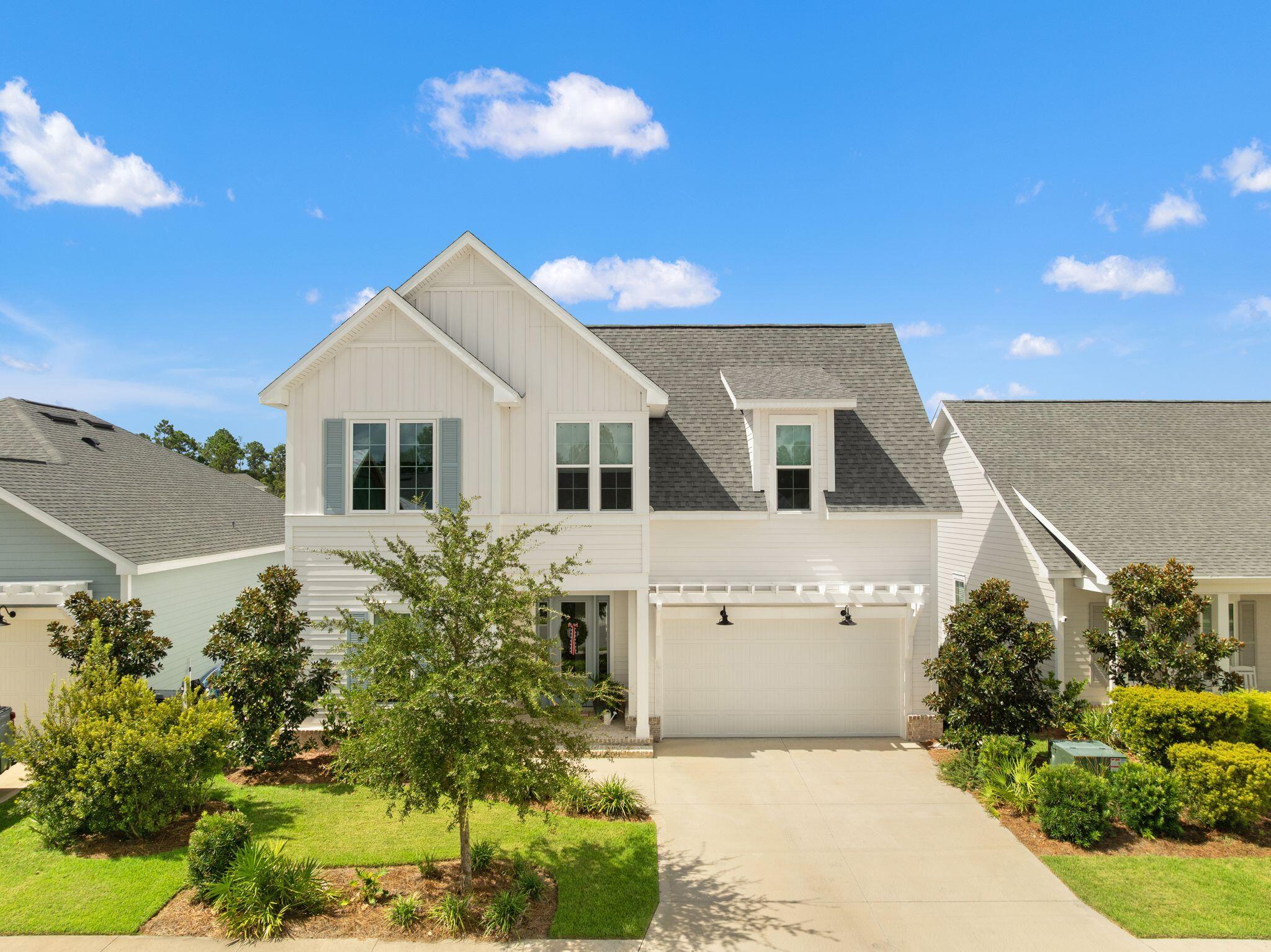 Welcome to 85 Bunting Lane in Watersound Origins. This Driftwood Floor Plan is a beautifully designed 4-bedroom, 3.5-bath Florida Cottage offering 2,360 square feet of comfortable coastal living. Ideally positioned near the front of the community, this home backs up to a peaceful pond, creating a private and scenic backdrop from the screened-in back porch and fenced backyard. Inside, thoughtful finishes include wood cabinetry, a tiled kitchen backsplash, tiled showers, quartz kitchen and bathroom countertops and recessed lighting throughout. The outdoor space is ideal for relaxing or entertaining, with a screened-in porch and outdoor gas stub. Residents enjoy access to a community pool and fitness center, sports courts, nature trails, Lake Powell dock access, golf, and abundant green space. Conveniently located near Watersound Town Center and the best of 30A, 85 Bunting Lane offers a relaxed coastal lifestyle in one of the area's most sought-after communities.