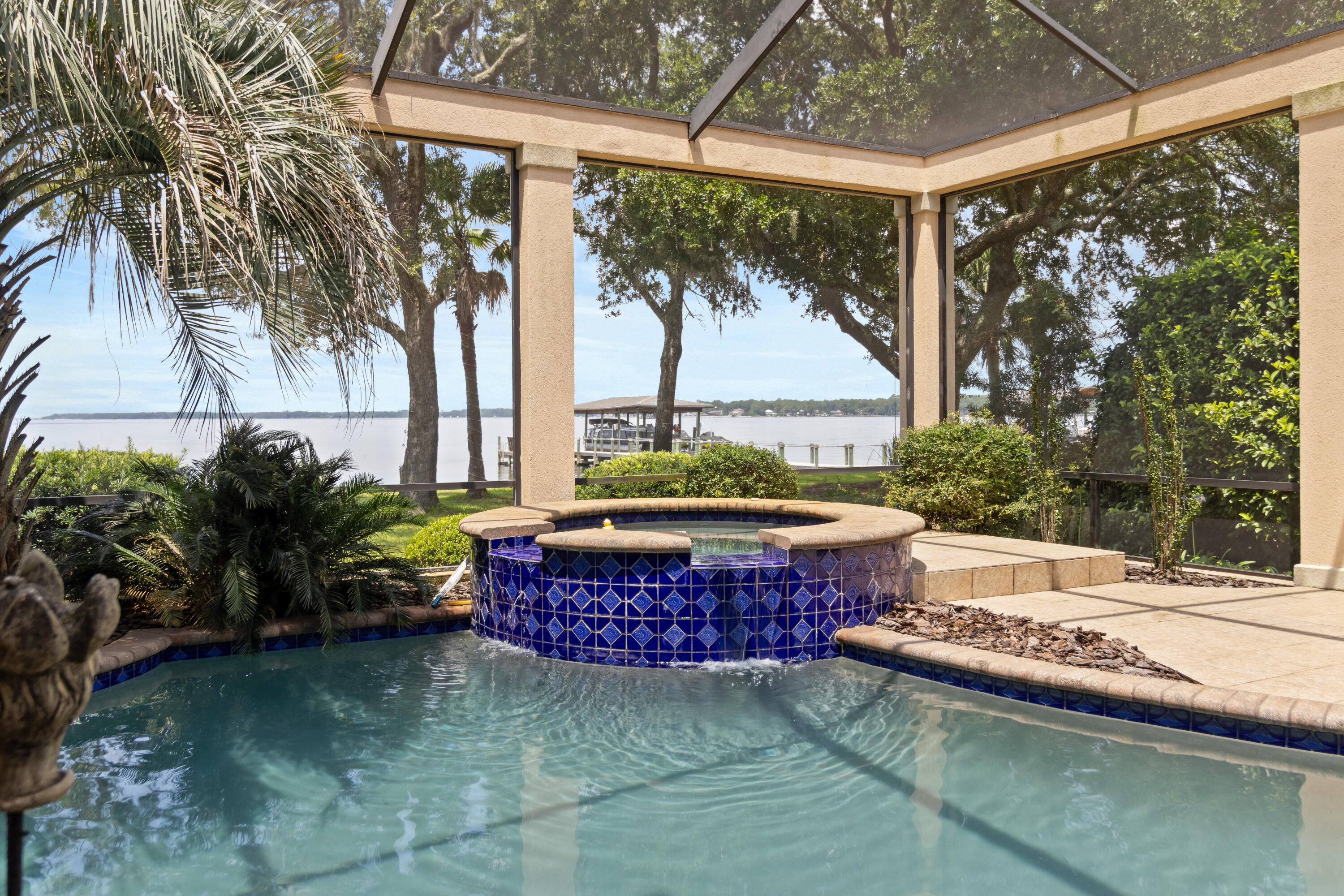Offered exclusively for the first time, 923 Lido Circle is a rare opportunity to own a masterfully designed, European-inspired bayfront estate in the coveted Bluewater Bay community. With nearly 7,000 square feet of living space and 8,710 total square feet, this home exemplifies elegance, privacy, and exceptional craftsmanship — all set on 100 feet of private waterfront along stunning Choctawhatchee Bay. Built by Maurice Sweet of Tier One Custom Homes, with meticulous German engineering, the home features exquisite European details throughout, from a scroll detailing the home's history encased in a glass-tiled entryway to custom Murano glass light fixtures, imported finishes, and high-end design elements. Each of the seven generously sized bedrooms features an ensuite, providing comfort and privacy for family and guests. A bay front office with a private bath serves as a tranquil work-from-home space with panoramic water views. The chef's kitchen is equipped with premium Miele appliances, including a steamer, wine refrigerator, ice maker, and a refrigerated walk-in pantry, perfect for both entertaining and everyday luxury. Large, open-concept living areas flow seamlessly, creating a layout ideal for gatherings, while still offering intimate retreats throughout the home. Outdoors, a fully enclosed saltwater pool and spa are surrounded by covered patios and balconies, with a summer kitchen complete with food prep and cooking areas. Whether relaxing by the pool or entertaining guests, the outdoor living spaces provide year-round enjoyment with sweeping views of the bay. The property's private party deck extends over the bay, providing a front-row seat to daily dolphin sightings, vibrant sunsets, and colorful rainbows. It's also equipped for boat dockage, offering convenient access to boating and water sports. Additional features include a guest house under beam, oversized walk-in closets, bidets in most bathrooms, solar panels for energy efficiency, and electronically controlled storm shutters for added security and peace of mind. Located in a quiet, upscale enclave of Bluewater Bay, this home is just minutes from the marina, Freedom Boat Club, sailing, water sports, LJ Schooners waterfront restaurant, and a host of recreational amenities, including golf, tennis, pickle ball, community pools, and walking trails. Destin's famed white-sand beachesincluding Crystal Beachare only a 10-minute drive away. The area also offers proximity to top-rated schools, shopping, dining, parks, hospitals, and all the conveniences of the Emerald Coast lifestyle. For the discerning buyer seeking a serene retreat that doesn't compromise on luxury, access, or amenities, this home represents an unparalleled coastal living experience.