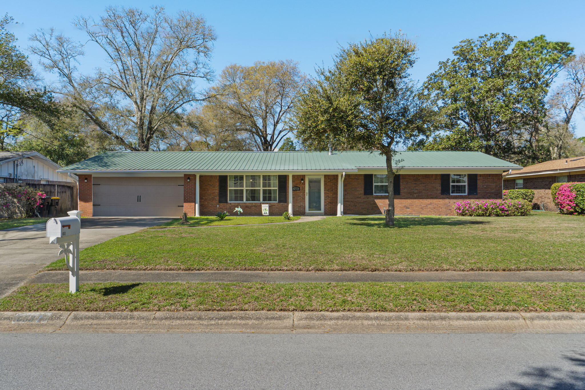 Welcome to this beautifully updated ranch-style home in one of Fort Walton Beach's most sought-after areas! Located in a sidewalk-lined community with a neighborhood park, pickleball courts, and tennis courts all within walking distance, this home offers both convenience and lifestyle. You're also walking distance to Kenwood Elementary school and just 15 minutes to the beach on Okaloosa Island, 10 minutes to Eglin Air Force base, less than 20 minutes to Hurlburt Field, and 10 minutes to the Destin-Fort Walton Beach airport! This 3 bedroom, 2 bath home also features a versatile flex room, ideal for a home office, playroom, or additional living space. Inside, you'll find two separate living areas, offering plenty of room to relax or entertain, along with a formal dining room perfect for hosting gatherings. The kitchen is thoughtfully designed with granite countertops, a breakfast bar, pantry, wall oven, built-in microwave, electric cooktop, and a refrigerator with ice and water dispenser. Just off the kitchen, the flex room/den with a wood-burning fireplace opens through French doors to a spacious 16x17 screened-in patio - an ideal spot to enjoy Florida evenings year round. Major systems have been well maintained, including a 2012 metal roof, 2012 water heater, and a brand-new HVAC system installed in 2024; and have peace of mind with a termite bond for preventative protection. Enjoy other notable features like updated windows, a fully fenced in backyard, sprinkler system, gutters, crown molding, recessed lighting, and new luxury vinyl plank flooring. And with no HOA there's even room to park your boat! This home checks all the boxes - updated, spacious, and perfectly located to enjoy the best of the Emerald Coast.