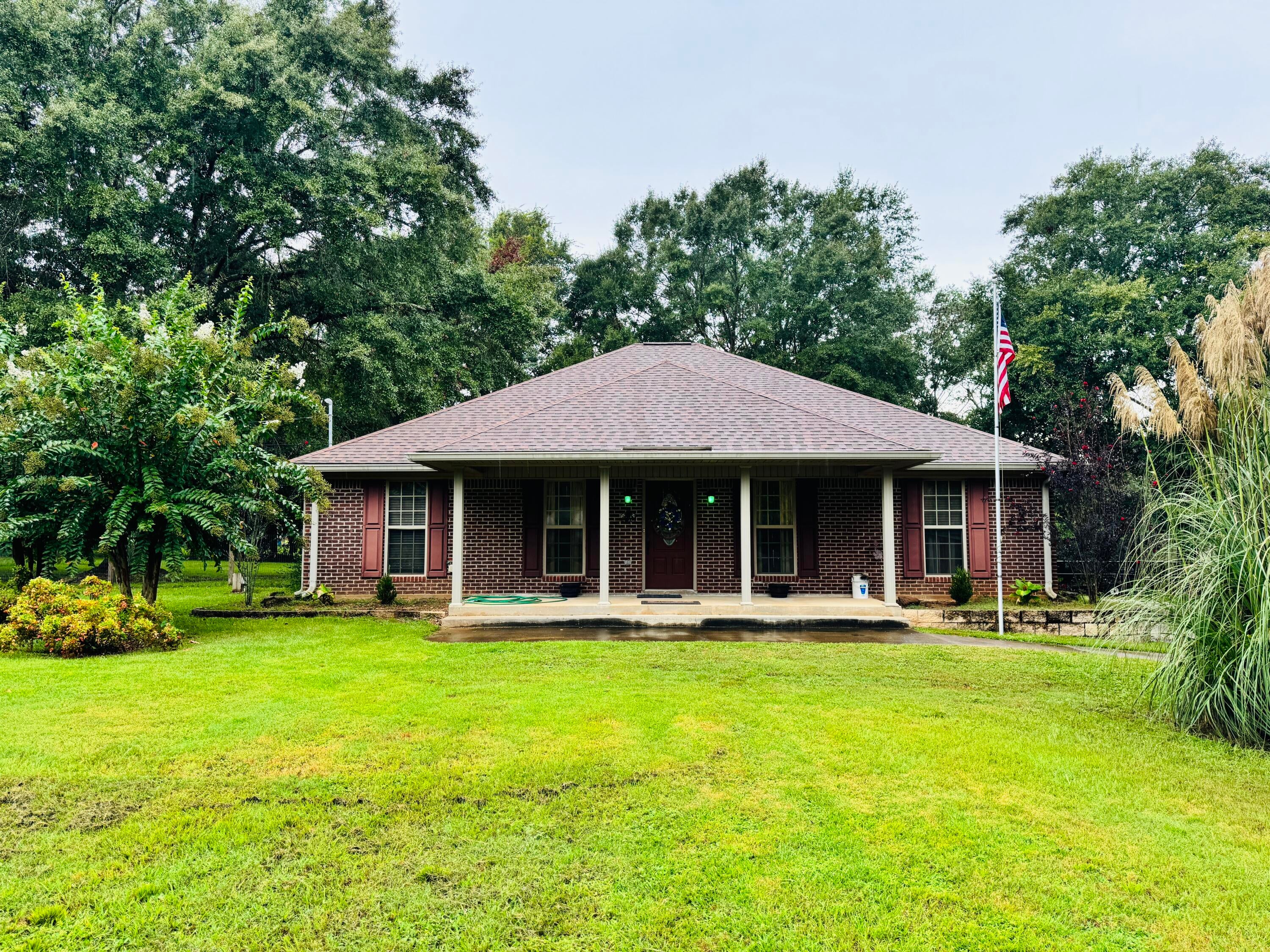 Nestled in the quiet charm of Florala, Alabama, this inviting 3-bedroom, 2-bathroom brick home offers both comfort and functionality on a spacious 0.86-acre lot. Perfectly situated just minutes from the scenic Lake Jackson and near the Alabama-Florida state line, this property blends peaceful country living with convenient access to outdoor recreation.

Inside, you'll find an open-concept layout where the generous living room--featuring a stunning cathedral ceiling--flows seamlessly into the kitchen. The kitchen is equipped with sleek stainless steel appliances and modern LVP flooring, while the entire home is designed with both style and practicality in mind.

Step outside to enjoy a fully fenced backyard. A standout feature of the property is the large shop with two roll-up doors, offering ample space for vehicles, hobbies, or storage.