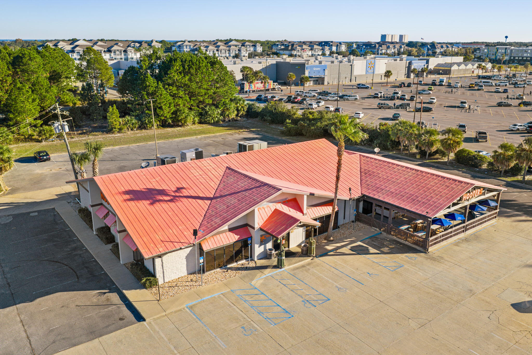 6000 SF restaurant with 2000 SF covered outside seating on the Emerald Coast Pkwy in Destin FL sits in front of Walmart, currently Hooters until April 1 2026, great location with large parking on 2.3 acres, prime location for any retail establishment, marketing package coming soon