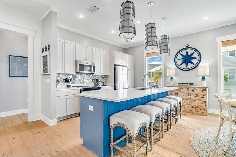 Bring Offers! Positioned on a premier corner lot along Beachcomber Lane, this exceptional property borders green space and offers front-row views of Seacrest Beach's newly designed Town Hall, amphitheater lawn, curated dining and gathering spaces. Ideally located between Alys Beach and Rosemary Beach, this setting places you at the heart of 30A's most coveted stretch and evolving coastal lifestyle.
This 5-bedroom residence is thoughtfully designed with a light-filled open layout and seamless indoor-outdoor living, complemented by expansive porches and outdoor spaces ideal for entertaining and relaxing.