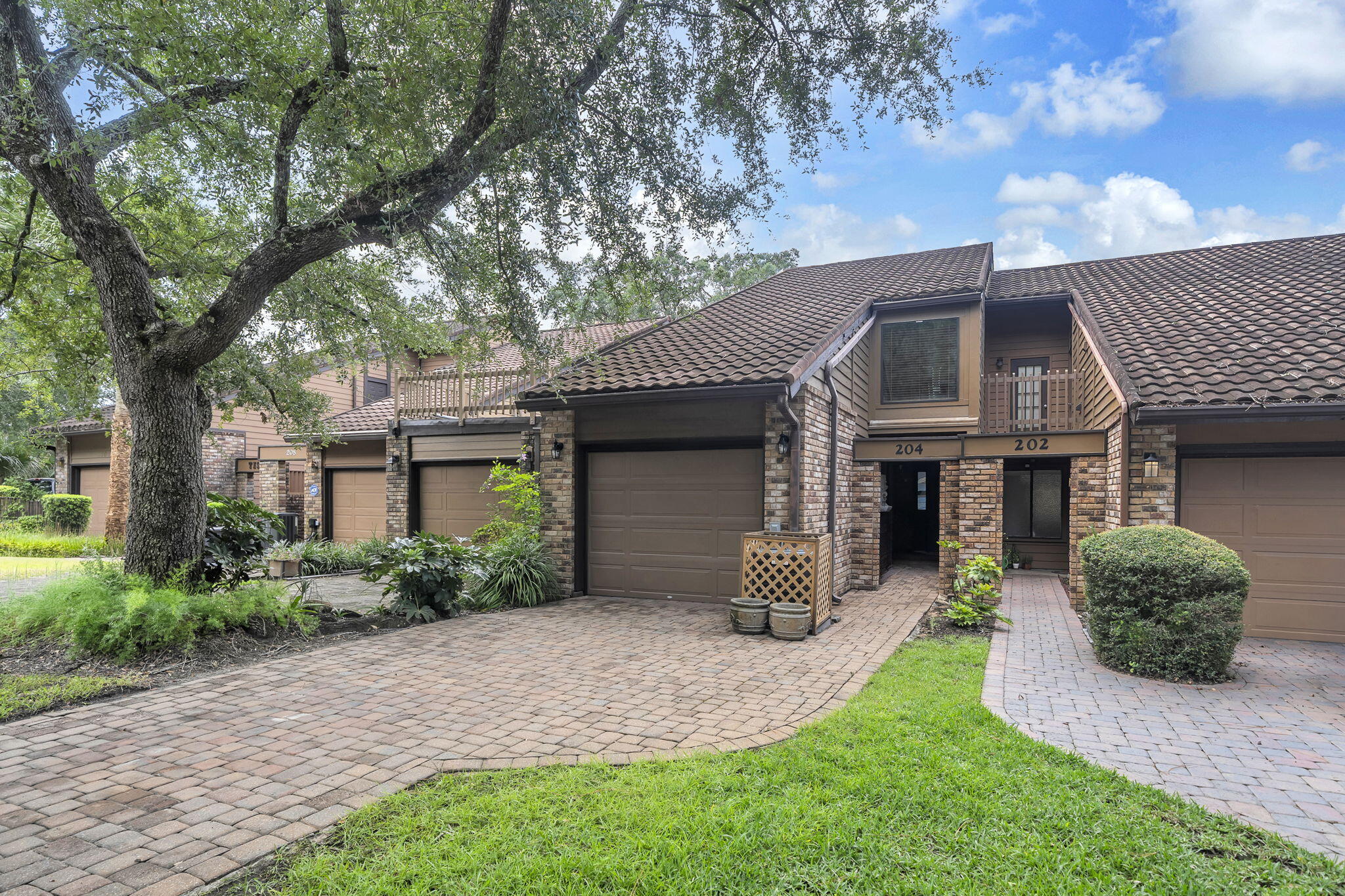 Your coastal oasis awaits. Featuring a private boat dock and instant access to the water, this exceptional property is a true standout. Residents enjoy premium community perks like a pool, tennis courts, and a covered picnic area. Your private backyard serves as a peaceful sanctuary, framed by majestic shade trees and soothing water views where you can fish at your leisure. The thoughtful floor plan includes a main-level bedroom, while the upper-level master suite opens up to a private balcony tailored for enjoying the evening bay breeze. The updated master bath features TWO vanities and TWO commodes separated by a large walk in shower. In addition to the master suite being upstairs, there is another bedroom AND a bonus room that would be the perfect gym, office or additional bedroom space! Units in Water Oaks with a downstairs bedroom are rare so don't miss this opportunity to make this yours!

Square footage figures are approximate and taken from tax records.