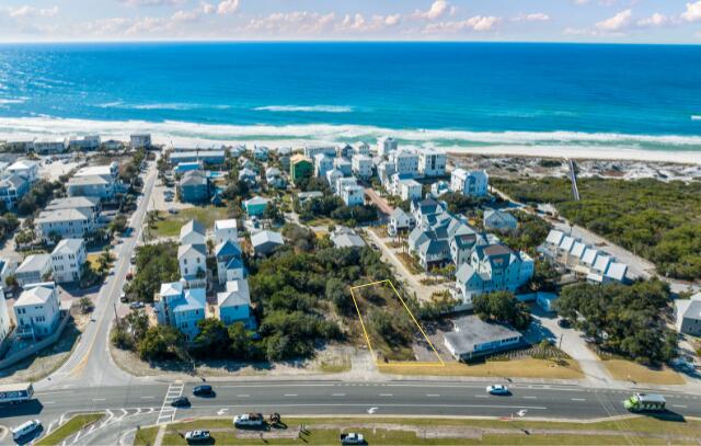ONE of the ONLY lots SOUTH-SIDE in Inlet Beach with a Village Mixed Use zoning. Incredible visibility being just east of Hwy 30A and 98 with approximately 32,500 daily traffic count per FDOT site. Inlet Beach is booming and needs commercial. Don't miss out on this unique opportunity to own commercial south-side property that is just steps from the Gulf. Views easily attainable. Outline on pictures is meant to be a guide, but not representative of exact property lines.