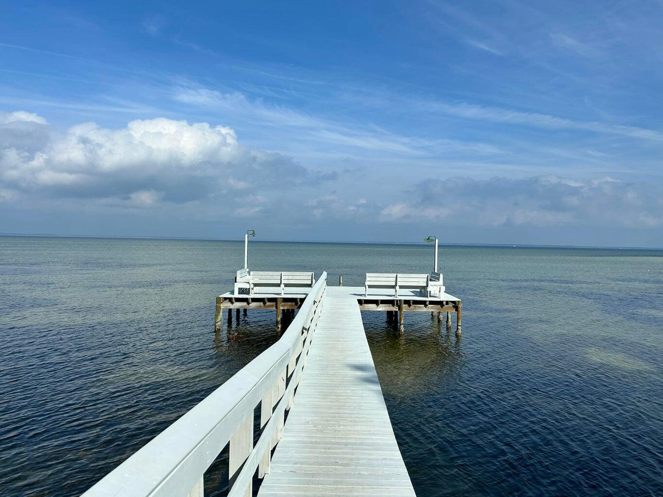 Beautiful 2-Bedroom, 2-Bathroom Townhome with Pool Views in Destin, FL

Welcome to your own slice of paradise in beautiful Destin, Florida! Located in the desirable Mossey Cove community, this charming 2-bedroom, 2-bathroom townhome offers a comfortable and inviting open-concept layout with fantastic views of the community pool.

Step inside and enjoy a bright, spacious living area designed for relaxing and entertaining. The open floor plan creates an easy flow between the living room, dining area, and kitchen, making this townhome feel both welcoming and spacious. A cozy fireplace adds warmth and character to the living space.

One of the highlights of this home is the screened-in, covered patio overlooking the beautiful community pool. Whether you're enjoying your morning coffee, relaxing with a good book, or unwinding after a day at the beach, this outdoor space is the perfect place to take in the peaceful pool views while enjoying the Florida breeze.

With two bedrooms and two full bathrooms, this townhome provides plenty of space for family, guests, or a relaxing coastal getaway. The combination of comfortable indoor living and a wonderful outdoor setting makes this property an ideal place to call home or enjoy as a vacation retreat.

Located in Destin, you'll be close to the area's beautiful white-sand beaches, emerald-green Gulf waters, shopping, dining, entertainment, and everything that makes the Emerald Coast such a sought-after destination.