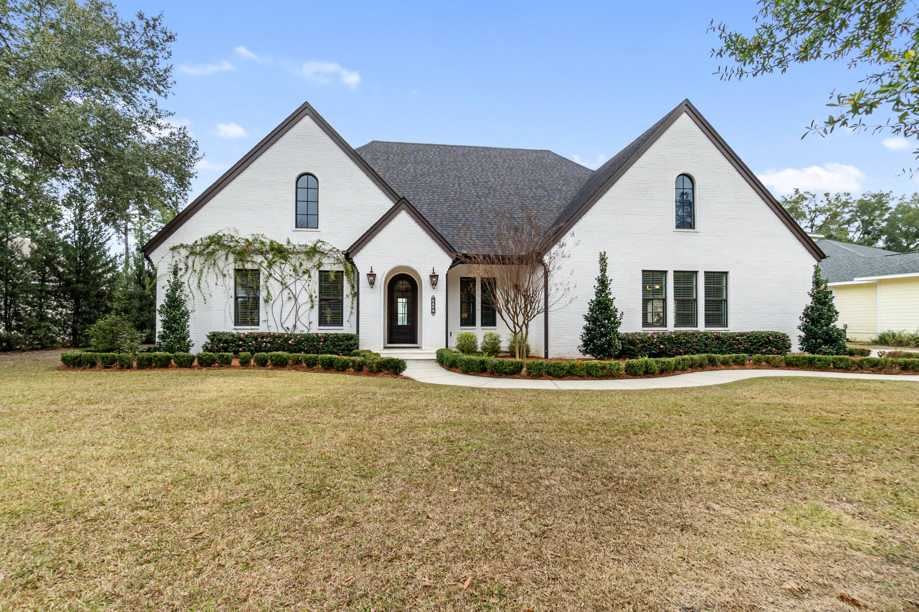 OPEN HOUSE 5/2/2026, 11AM-1PM. Welcome to the Blackwater Jewel, a rare waterfront opportunity in Bay Pointe Plantation. Situated on the largest lot in the neighborhood, this custom brick home offers panoramic views of Blackwater Bay and the advantage of an X flood zone with no flood insurance required. Built in 2018, the 3,815 sq ft residence features an open concept design with wood flooring, custom built ins, and a gas fireplace, all oriented toward the water. The kitchen includes quartzite countertops, double ovens, a custom island, and a well appointed scullery. Outdoor living shines with a covered porch, outdoor kitchen, and a private dock with boat storage, creating a true waterfront lifestyle.