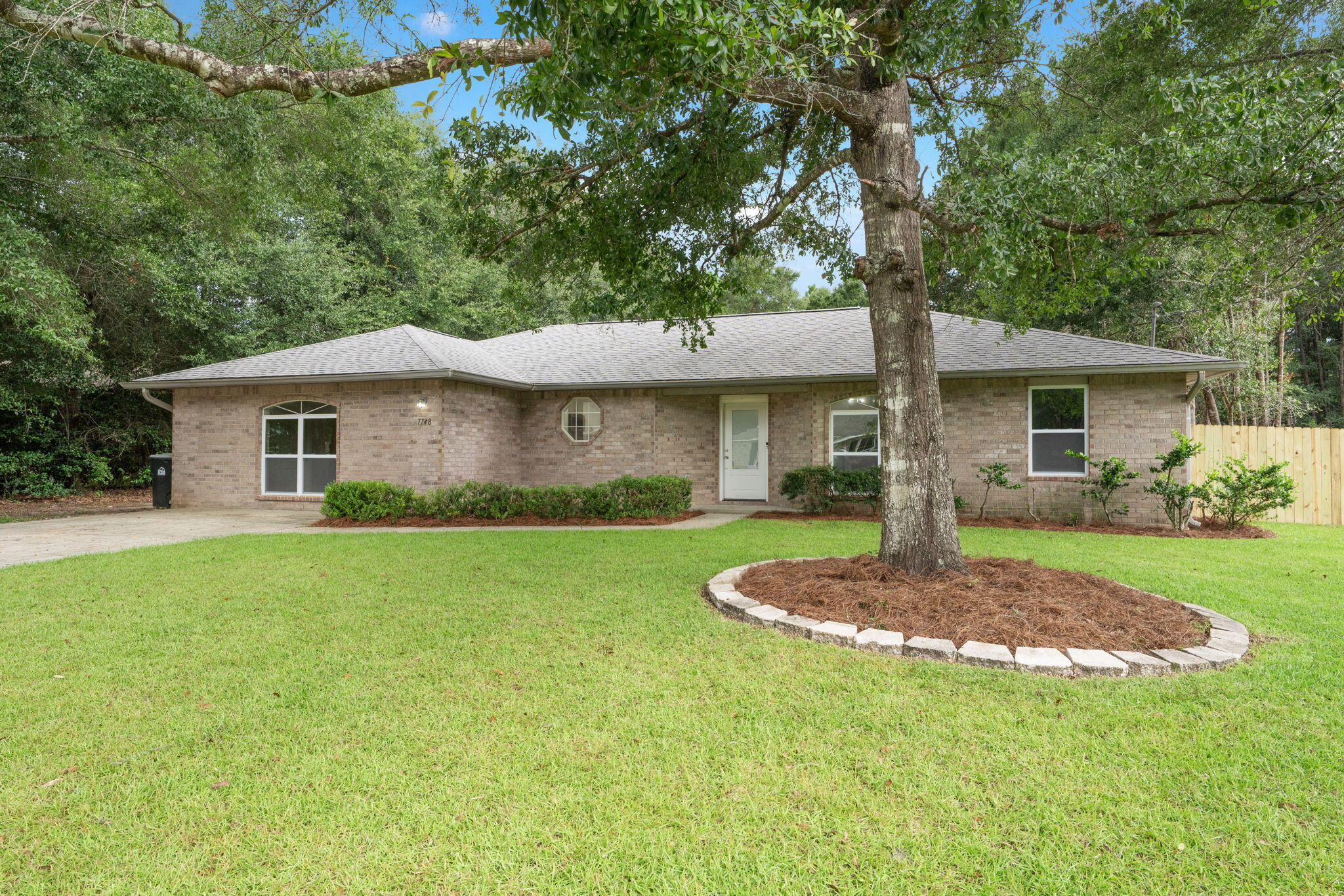 OPEN HOUSE! Sunday, 9/27 from 10-12pm. Welcome to a beautifully updated home where every major system and finish has been thoughtfully renewed, so you can simply move in and enjoy. Sitting on .67 of an acre, this 4-bedroom, 2-bath residence offers 1,968 square feet of comfortable, modern living just minutes from major highways and only 30 minutes from the white sands of Navarre Beach.
Inside, the upgrades are everywhere: brand-new HVAC, roof, and water heater, plus fresh paint and new flooring throughout. The kitchen is a showstopper with new cabinets, stunning 3cm quartz countertops, new appliances, a charming apron sink, and large island. Both bathrooms feature full tile showers with new vanities and countertops. The whole home glows with new lighting, including ceiling fans in the living room and every bedroom. The extra large 4th bedroom has endless possibilities for multiple uses. 
With its spacious lot, modern finishes, and convenient location this Milton gem is ready for its next owners. Schedule your private showing today!