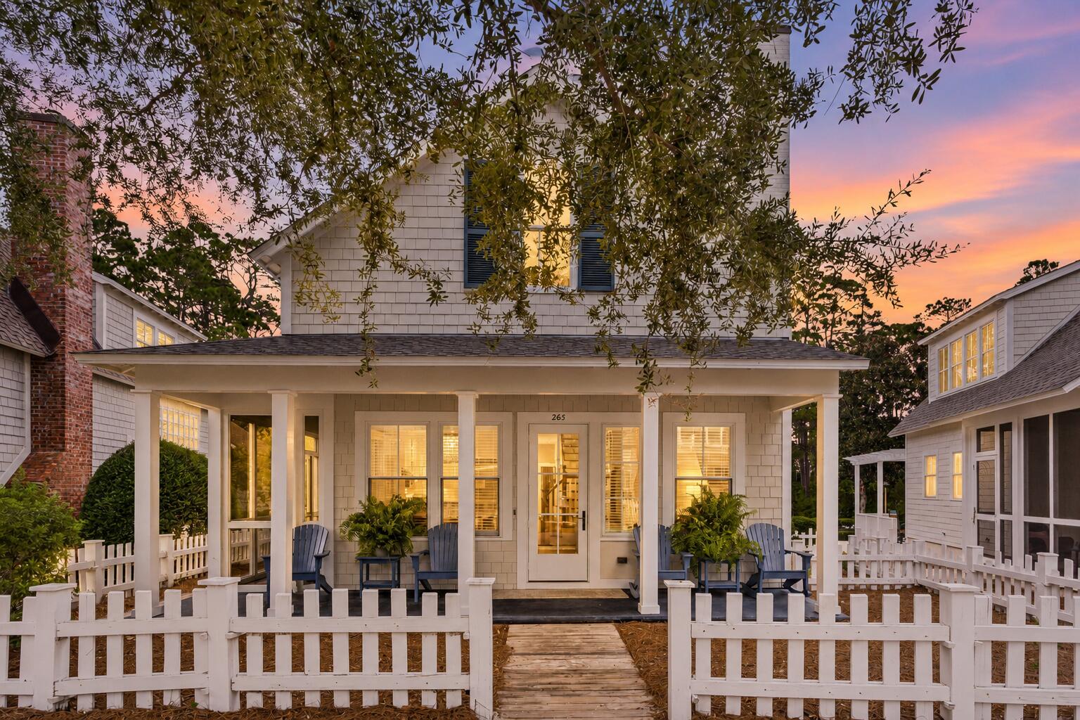 A rare opportunity at a hard to find price point in WaterSound Beach, an upscale private coastal community located along Scenic Highway 30A. 265 Salt Box Lane brings together a compelling combination: three bedrooms plus a third-floor tower with additional sleeping, a garage, room for a private pool, strong rental potential, and an easy stroll to over a one-mile stretch of sugar-white sand, turquoise water and steps to the WaterSound Beach Club.
Behind the quintessential white picket fence, this shingle-clad coastal cottage has the charm and character that make WaterSound Beach so special. A charming front porch sets the tone for an inviting place for morning coffee or unwinding after a day on the beach. Inside, soaring ceilings and a wall of windows fill the great room with natural light, while an open kitchen create a warm gathering space. The primary suite features vaulted tongue-and-groove ceilings and a spa-like bathroom. Two additional bedrooms accommodate family and guests, while the third-floor tower provides valuable additional sleeping and flex space. Perhaps the greatest opportunity at 265 Salt Box is what can still be added. The backyard offers room to create an outdoor retreat with private pool, while the garage configuration presents an opportunity to add a carriage house. Enjoy the home as it is today or further enhance it over time. Within the gated beachfront community of WaterSound Beach, owners enjoy private beach access, community pools, scenic boardwalks, shopping, entertainment and dining options all within an unmistakable coastal setting. 

For buyers waiting for the right opportunity to own in WaterSound Beach without stepping into the community's higher price tiers, 265 Salt Box Lane deserves a closer look.