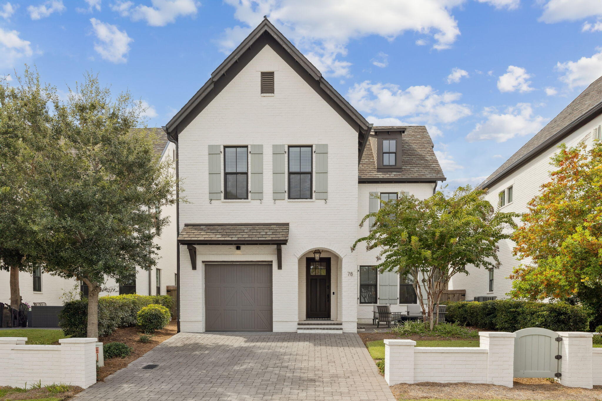 Just like new, quality-built by Randy Wise Homes, this French inspired coastal community offers beautifully crafted residences with timeless design and thoughtful detail. Impeccably maintained, this home showcases superior construction and a sophisticated aesthetic throughout. With a courtyard in the front and a custom patio in the rear, you can enjoy morning coffee or dining al fresco.

Each space has been intentionally designed for comfort, style, and effortless functionality. Hardwood floors, 10' ceilings & smart-home features. No short-term rentals allowed.

Enjoy resort-style amenities just steps from your front door. The Ridgewalk Circle community pool features zero-entry access, soothing water features, a hot tub, and plenty of lounge space for relaxing under the Florida sun. Nearby, a covered pavilion offers picnic tables, comfortable seating, gas grills, and televisions--perfect for gathering with family and friends.

When you're ready for the beach, the Ed Walline Regional Beach Access is less than a mile away, providing easy access to the sugar-white sands and emerald waters of the Gulf. This prime location also places you moments from the shopping, dining, and entertainment of Gulf Place, including local favorites like Shunk Gulley. With Scenic Highway 30A's renowned walking and biking paths, charming boutiques, and vibrant coastal lifestyle nearby, you'll have everything that makes 30A so special right at your fingertips. Quality construction is evident throughout, with a durable composite roof and classic brick exterior providing both lasting value and exceptional curb appeal.

Outside, the manicured grounds and inviting outdoor spaces offer a perfect extension of the home. Whether enjoying morning coffee or dining al fresco, the setting provides both privacy and tranquility with a large courtyard in the front and a custom patio space in the rear.