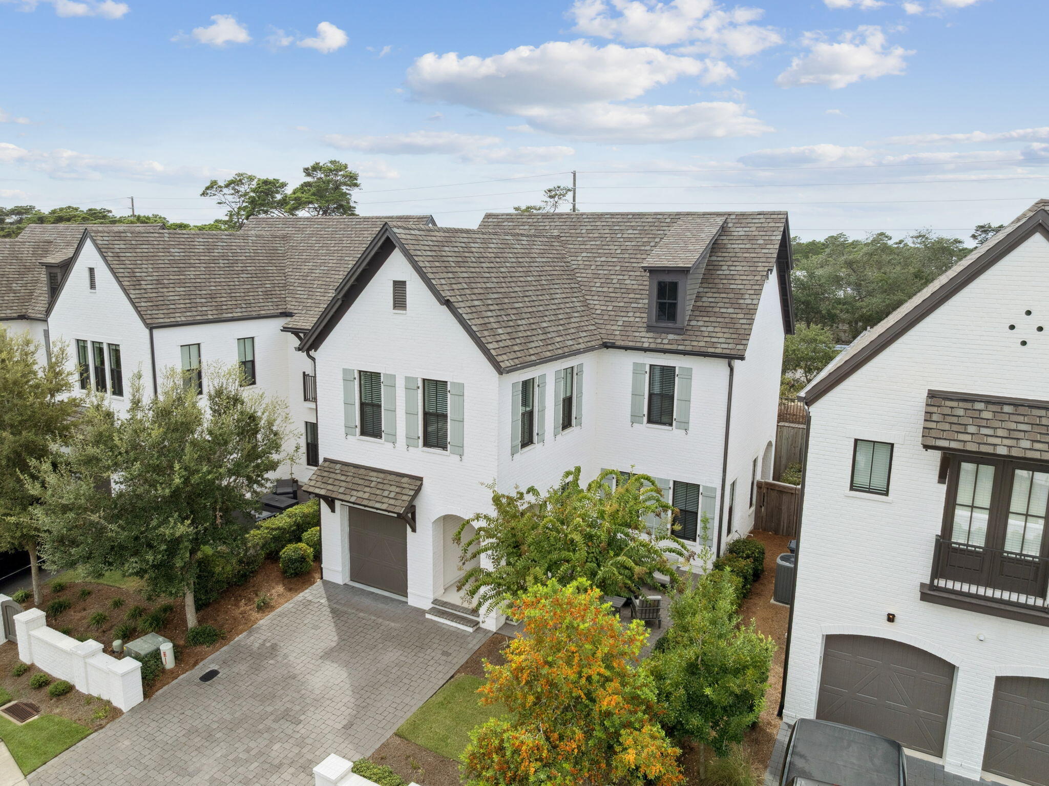 Just like new, quality-built by Randy Wise Homes, this French inspired coastal community offers beautifully crafted residences with timeless design and thoughtful detail. Impeccably maintained, this home showcases superior construction and a sophisticated aesthetic throughout. With a courtyard in the front and a custom patio in the rear, you can enjoy morning coffee or dining al fresco.

Each space has been intentionally designed for comfort, style, and effortless functionality. Hardwood floors, 10' ceilings & smart-home features. No short-term rentals allowed.

Features: central vac, tankless water heater, surround sound, quartz counters, soaking tub and a maintenance free lawn.

Enjoy resort-style amenities just steps from your front door. The Ridgewalk Circle community pool features zero-entry access, a hot tub, and plenty of lounge space. Nearby, a covered pavilion offers picnic tables gas grills, and televisions--perfect for watching football.

When you're ready for the beach, the Ed Walline Regional Beach Access is less than a mile away, providing easy access to the sugar-white sands and emerald waters of the Gulf. This prime location also places you moments from the shopping, dining, and entertainment of Gulf Place, including local favorites like Shunk Gulley. With Scenic Highway 30A's renowned walking and biking paths, charming boutiques, and vibrant coastal lifestyle nearby, you'll have everything that makes 30A so special right at your fingertip Quality construction is evident throughout, with a durable composite roof and classic brick exterior providing both lasting value and exceptional curb appeal.

Outside, the manicured grounds and inviting outdoor spaces offer a perfect extension of the home. Whether enjoying morning coffee or dining al fresco, the setting provides both privacy and tranquility with a large courtyard in the front and a custom patio space in the rear.