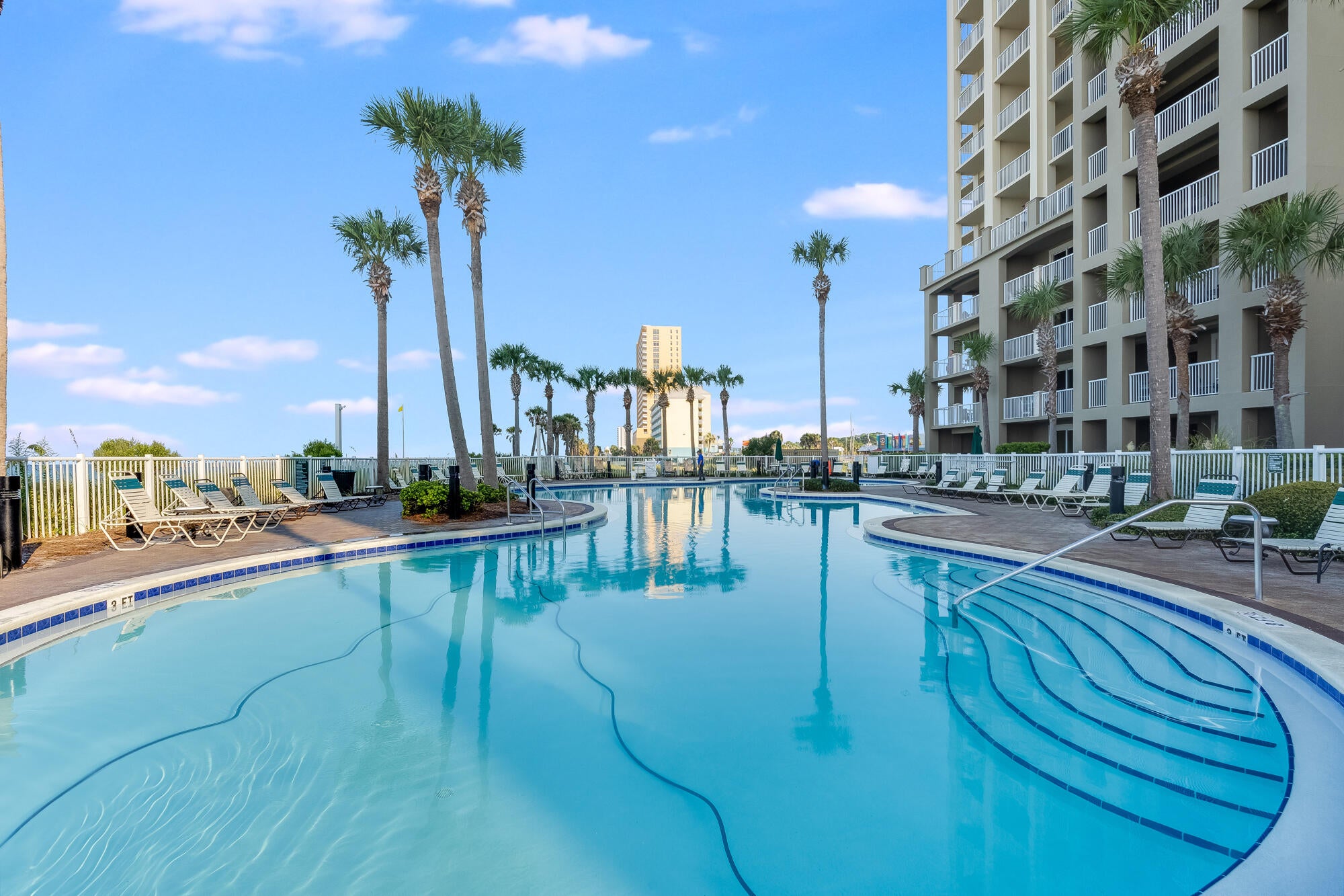 Welcome to 1-1907 at Grand Panama Resort, a beautifully appointed 19th-floor-unit 2-bedroom, 2-bath with Hallway Bunks. Condo overlooks the sparkling Emerald Coast waters. Privately owned but is placed in a short-term rental program, the property has been meticulously cared for and remains in exceptional condition. Tile and LVP flooring, updated backsplash, beautifully painted, dishwasher, washer and dryer combo, water heater, and all furnishings with a refined coastal aesthetic. The open living space extends to a oversized balcony shared with the primary suite, creating an effortless connection to the Gulf from sunrise through sunset. Its turnkey presentation makes 1907 equally appealing as a sophisticated vacation home or an investment poised for the short-term rental market.Grand Panama offers two pools, two hot tubs, fitness center, tiki bar, dog park, beach access and 24-hour security. Tower 2 features Grand Pizzeria and Coffee Co., while a coded-access nature walk leads to Another Broken Egg. Covered parking in Tower 2 connects to Tower 1 via a 5th-floor elevator to the covered bridge.  Highly sought-after storage closets are available for an annual fee and renew each January, plus storage cages. Owners also have access to discounted annual beach chair service. 1907 is the total package & offers an exceptional Gulf-front opportunity.Call and schedule your showing today. Grand Panama is a Condotel.
