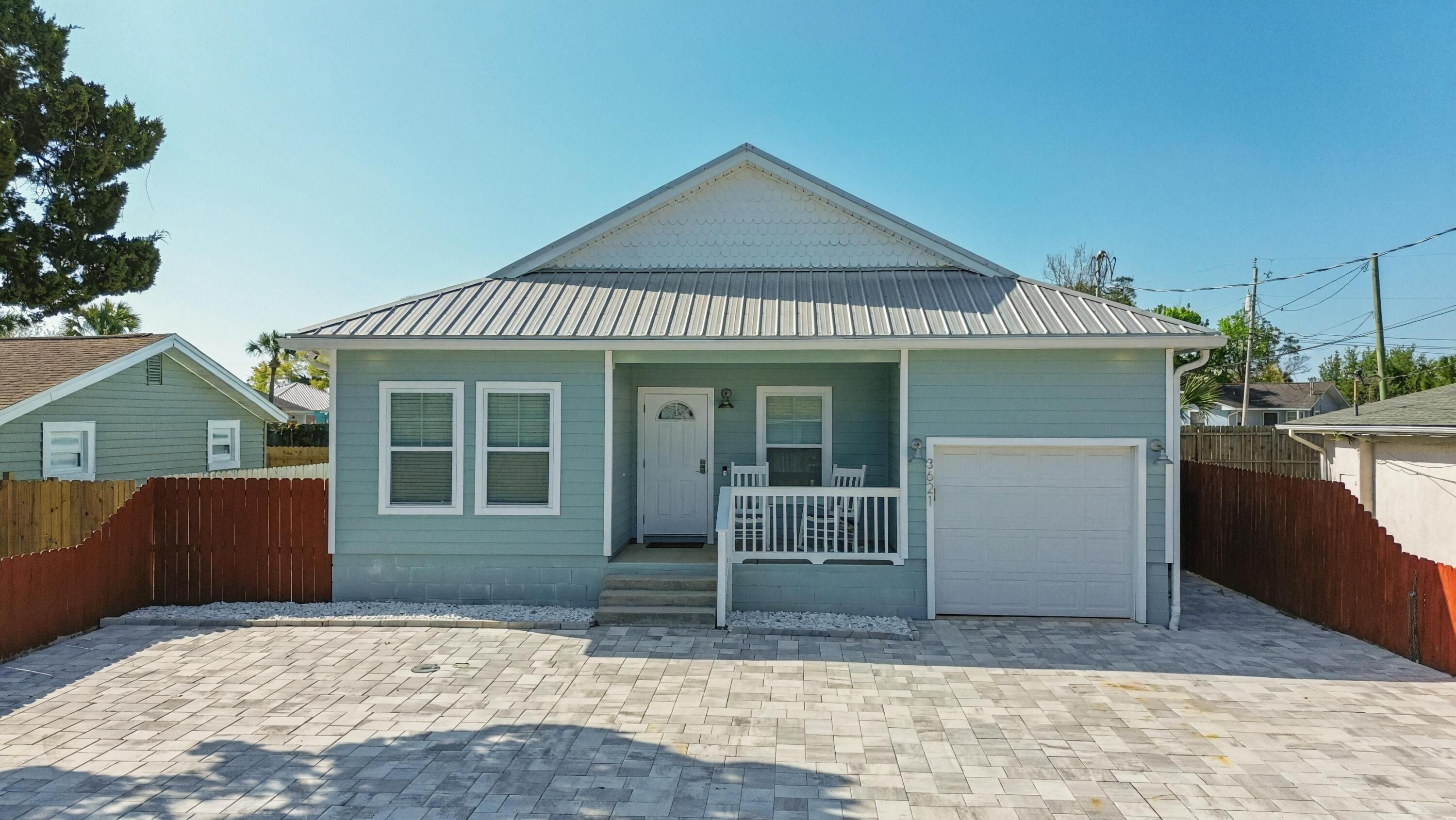 Turnkey Beach Retreat, 6 Blocks to Gulf, Short term rental allowed! Discover the perfect coastal investment or primary residence at 3621 Biltmore Drive. Built in 2019, this modern 3-bedroom, 2-bathroom home is situated in the highly sought-after Lower Grand Lagoon area of Panama City Beach. Offering 1,146 sq. ft. of optimized living space, this property combines contemporary construction with the high-demand ''No HOA'' lifestyle. Location is the ultimate amenity. You are just 6 blocks from the sugar-white sands of the Gulf and steps away from Grand Lagoon. Tucked away on a quiet dead-end street, you enjoy peace and privacy while remaining minutes from St. Andrews State Park, world-class dining, and all PCB has to offer. Step inside to a bright, open-concept floor plan designed for durability and style. Beautiful tile flooring throughout, perfect for sandy feet and easy cleaning. Features a brand-new dishwasher and stove (Oct 2023). The high-quality furniture is only 6 months old and available for purchase separately, making this a potentially turnkey, rent-ready opportunity from day one. Parking for 4+ vehicles + one car garage! Front pavers were installed in 2022 and the property features a fully fenced backyard with a private outdoor shower. New gutters with French drains installed in 2022. 2019 construction means lower insurance premiums and modern energy efficiency. With no HOA fees and short-term rentals allowed, this property is a standout for investors looking to capitalize on the PCB vacation market or for the perfect primary beach residence. Schedule your showing today!