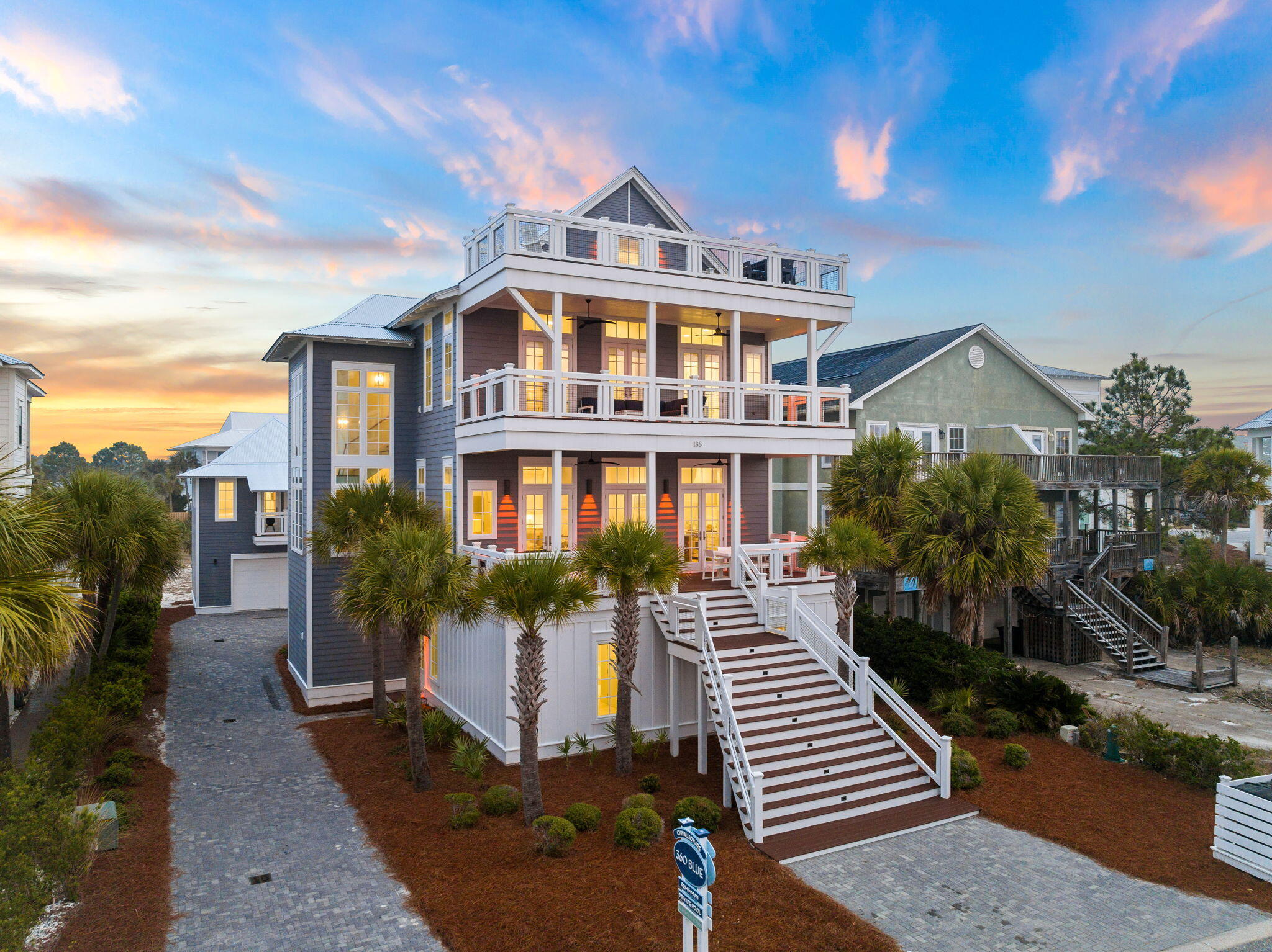 Perfectly positioned on a quiet cul-de-sac in the coveted Walk Over Dunes community, this extraordinary gulf-view beach retreat offers the ultimate combination of luxury, comfort, and investment potential. Spanning four stories, this impressive 9-bedroom, 8.5-bath residence comfortably accommodates up to 36 guests and is being offered fully furnished and rental-ready. Just steps from public beach access, the home is designed for unforgettable gatherings with expansive outdoor terraces on every level, an oversized heated pool with cascading water feature and spa, and a private pickle-ball court, all creating an exceptional coastal experience.

Thoughtfully designed for entertaining, the first floor features a spacious family room and an adjoining game room complete with a pool table, air hockey, and oversized sectional seating. Sliding glass doors open to a sprawling covered terrace with a summer kitchen, grilling area, outdoor dining space, and a large flatscreen TV overlooking the pool and spa. Two oversized bunk rooms on this level are designed to maximize guest accommodations, each featuring multiple custom bunks and private ensuite bathrooms with dual vanities. Each bunk-room bathroom also includes two separate showers, thoughtfully designed to comfortably accommodate large groups and streamline guest use after beach and pool days. The second floor serves as the heart of the home, showcasing a generous open-concept living area with refinished flooring, shiplap ceilings, and abundant natural light. The gourmet kitchen is equipped with premium stainless steel appliances, double dishwashers, floor-to-ceiling cabinetry, and an expansive island, while the adjacent dining area easily accommodates large gatherings. Two beautifully appointed king suites with private ensuite baths complete this level.

The third floor offers additional guest accommodations, including a king suite with private bath, a guest bedroom connected via Jack-and-Jill bath to a bunk room, and an impressive primary suite featuring a private balcony, spa-inspired bathroom with soaking tub and walk-in shower, and stunning gulf views.

The top floor, you will find a spectacular retreat with a TV lounge, sitting area, and panoramic gulf views that provide the perfect backdrop for sunset entertaining.

Adding even more versatility, the separate carriage house offers a private guest escape complete with a king bedroom, full bath, living area with sleeper sofa, and fully equipped kitchen.

With ample parking, strong rental income potential, exceptional amenities, and an unbeatable location just moments from the sugar-white sands of the Gulf, this remarkable property presents a rare opportunity to own a premier coastal investment and family retreat.

All information is believed to be accurate but should be verified.