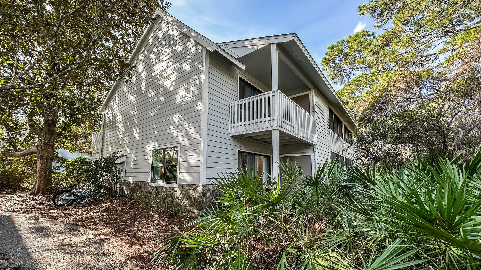 CASSINE GARDENS IS ONE OF THOSE SPECIAL PLACES ON 30A where the natural beauty and quieter character of Seagrove Beach have been preserved. Tucked among mature pines, cypress trees and magnolias, the community is woven together by winding nature trails through the surrounding forest, a peaceful pond and its picturesque walking bridge. All of this is just a short stroll from South Walton's white-sand beaches, the emerald waters of the Gulf and sunsets that never seem to disappoint. Ideally situated within Cassine, Unit 133 is an end residence with a particularly peaceful setting and rear views overlooking the woods, pond and picturesque walking bridge. The 2-bedroom, 2.5-bath floor plan encompasses 1,252 square feet of living space and includes an enlarged primary bedroom with plenty of room for a king-size bed plus bunks--creating additional sleeping space for family and guests.
Life in Cassine includes two community pools, tennis and pickleball courts and scenic walking trails, while the 30A bike path and many of Seagrove Beach's favorite restaurants and shops are close enough to walk or bike. Quietly tucked away from the activity of 30A, yet close to everything that makes Seagrove Beach special.