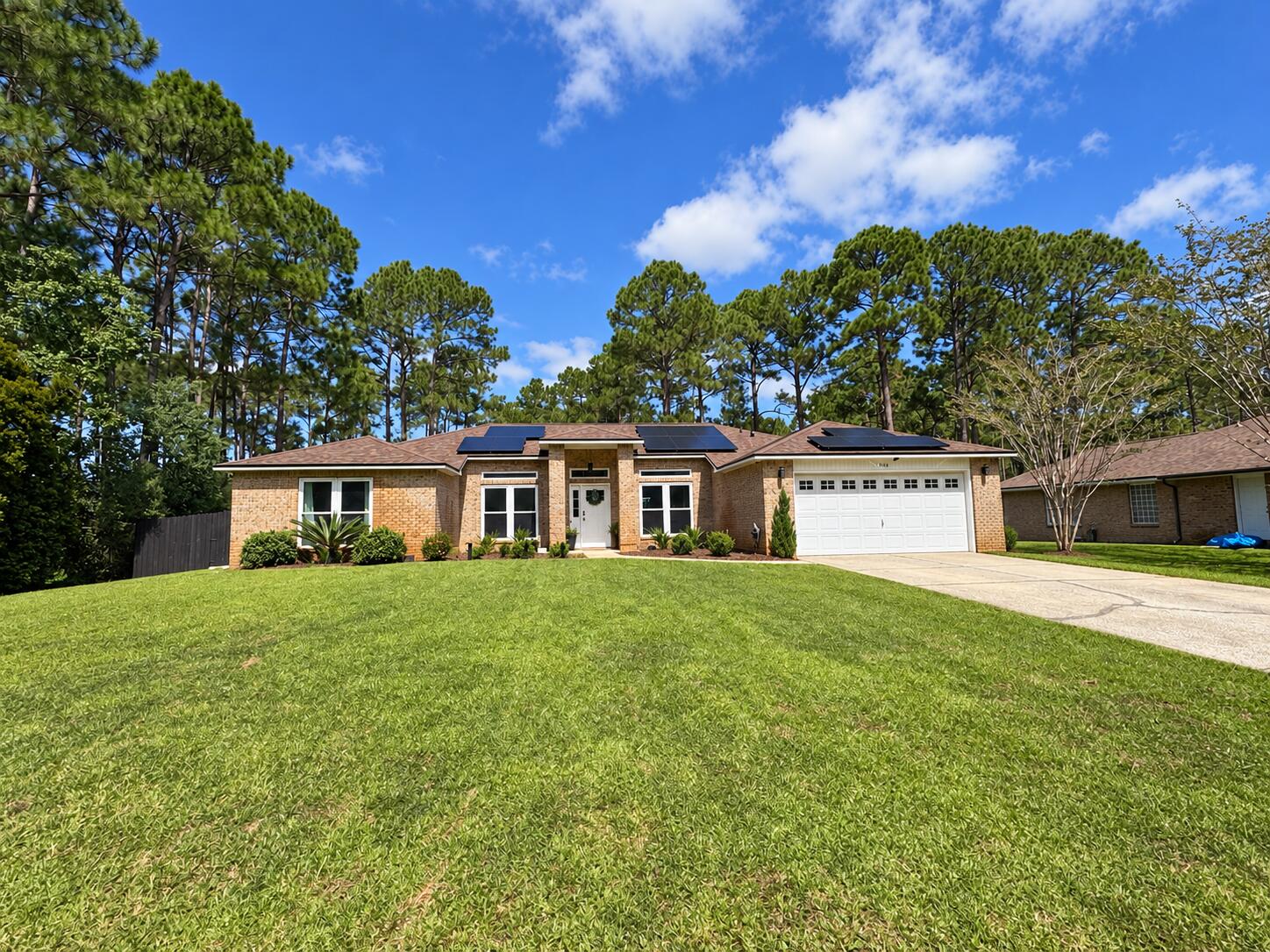 Welcome to 7534 Duval Street, where a high end renovation has transformed this Holley by the Sea residence into a sophisticated retreat designed for elevated Florida living. With approximately $300,000 invested in improvements, this 4-bedroom plus office, 2-bath home pairs timeless all-brick construction with thoughtfully selected high-end finishes, a private pool, and an impressive outdoor living space.

At the heart of the home is a showpiece kitchen representing approximately $100,000 in improvements. Designed to feel as beautiful as it is functional, the kitchen anchors the main living areas and creates an inviting setting for both everyday living and entertaining. High-end porcelain tile flooring carries throughout the home, complemented by beautifully remodeled bathrooms and a spacious great room with soaring cathedral ceilings.

The primary suite is privately positioned in its own wing and offers a beautifully updated bath designed with a refined, spa-inspired feel. Three additional bedrooms provide flexibility for family and guests, while the dedicated office creates an ideal space for working from home.

The upgrades extend well beyond the interior. A new roof, impact-rated windows and doors, and paid-off solar panels add substantial value and efficiency, while the backyard delivers the Florida lifestyle buyers are searching for. A private swimming pool and expansive screened lanai create a true outdoor extension of the home, perfect for entertaining, relaxing, or enjoying the Northwest Florida climate year-round.

Located in the highly sought-after Holley by the Sea community, ownership includes access to its approximately 45-acre recreational complex featuring swimming pools, tennis courts, fitness facilities, basketball courts, playgrounds, community amenities along Santa Rosa Sound, and access to the East Bay boat launch.

7534 Duval Street offers a rare combination: an extensively renovated home, significant high-end improvements, private pool, energy-conscious upgrades, and access to one of Navarre's most amenity-rich communities--all just minutes from the sugar-white sands and emerald waters of the Gulf of Mexico.

This isn't simply an updated home. It's a property where the major investments have already been made, allowing the next owner to step into a beautifully finished Florida lifestyle from day one.