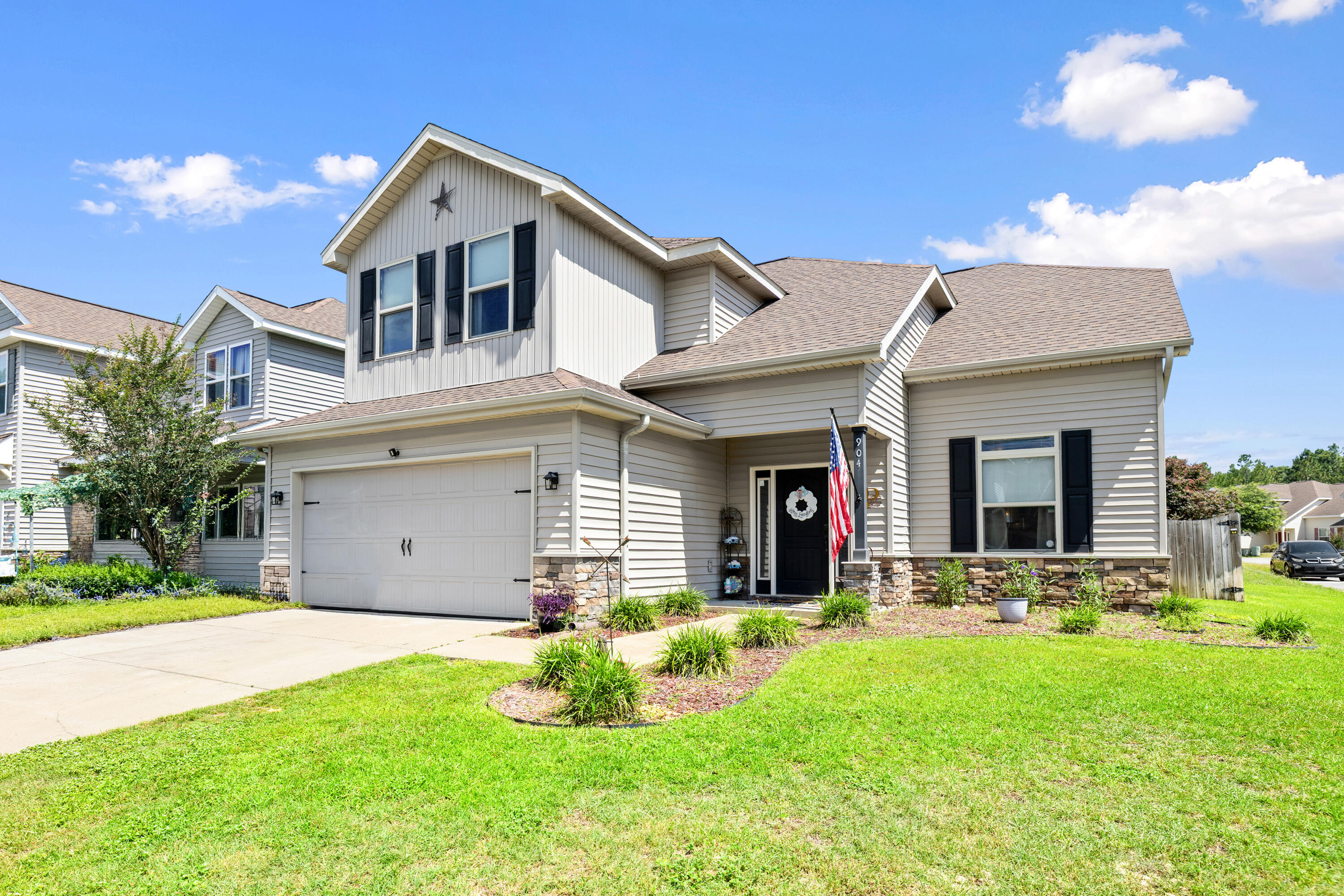 Welcome to Sandy Ridge SOUTH OF I10, where comfort, convenience, and functionality come together in this beautifully maintained 4-bedroom, 2.5-bathroom home with flex room is situated on a spacious corner lot in South Crestview. Ideally located only 15 minutes from the Army's 7th Special Forces Group and Duke Field, this community also offers a neighborhood playground for residents to enjoy.

Step inside to find soaring ceilings create a grand first impression upon entry, while fresh interior paint and new carpet in all bedrooms give the home a clean, updated feel. The main living areas feature durable laminate wood-look flooring throughout, offering both style and easy maintenance. The spacious kitchen is designed for everyday living and entertaining alike with a large center island, stainless steel appliances, additional cabinetry for extra storage, and a walk-in pantry.

Step outside to your own backyard retreat complete with a brick paver patio, fenced backyard, and fire pit, making it the perfect place to unwind after a long day. The two-car garage adds even more functionality with custom shelving and an additional refrigerator that conveys with the home. Best of all, this section of Sandy Ridge has no HOA fees.
This move-in ready home offers the space, location, and upgrades today's buyers are searching for.