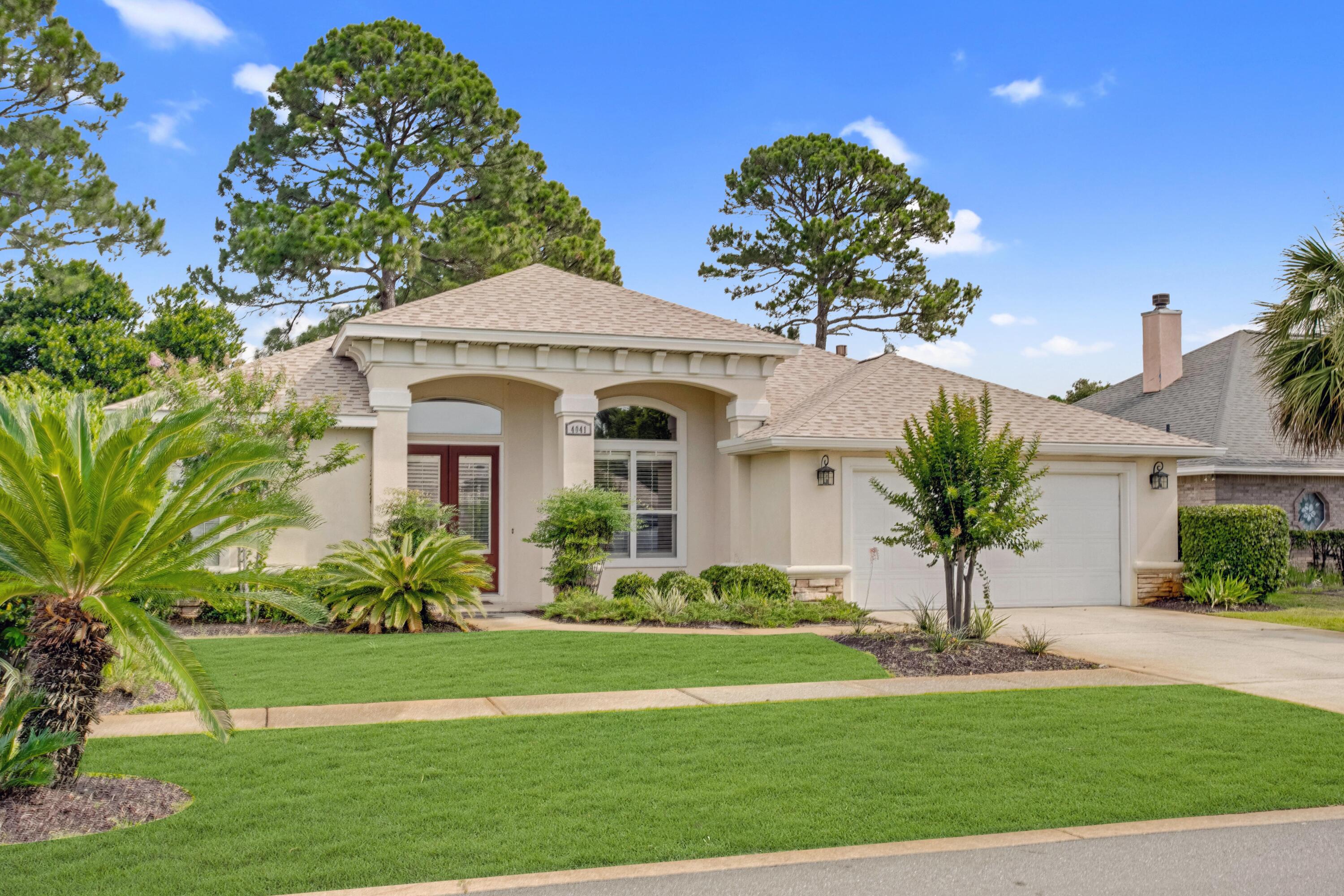 Beautiful 3-bedroom, 2-bath home located in the highly desirable Indian Lake subdivision within the heart of Destin. The kitchen features Quartz countertops, tile backsplash, stainless steel appliances, gorgeous pendant lights above the breakfast bar, cabinet under lighting, pantry, and a gas range. Tile & luxury vinyl flooring extend throughout the house, ideal for sandy beach living & easy maintenance. The split bedroom floor plan places the master bedroom at the front of the home giving it more privacy. The spacious master bedroom features a beautiful tray ceiling with cove lighting, direct access to the back patio, and a walk-in closet. The master bath offers a walk-in shower, jetted tub, double vanity, and another walk-in closet. All 3 bedrooms are generous in size & feature walk-in