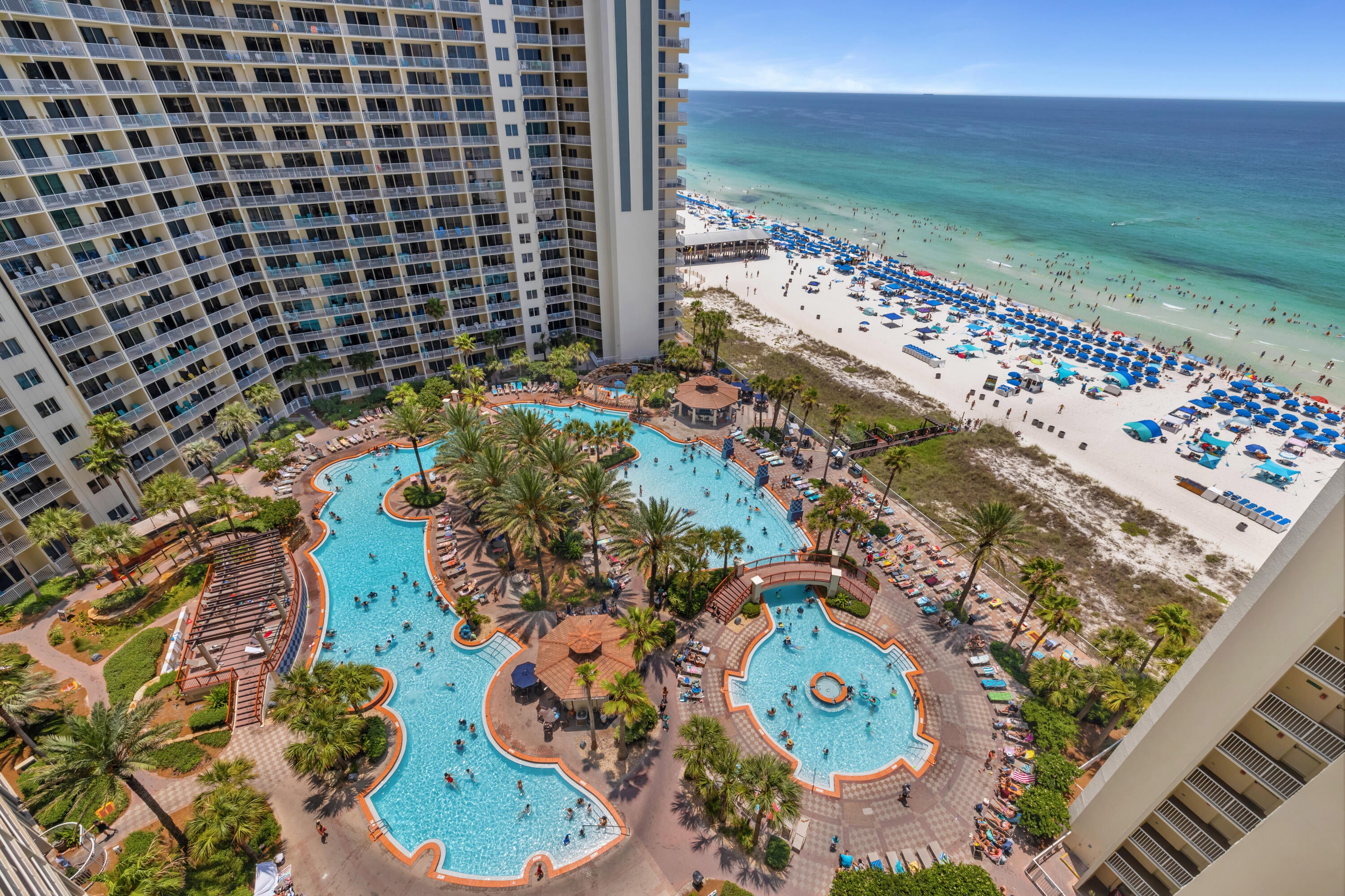 TROPICAL STYLE INSIDE. LAGOON POOL AND GULF VIEWS OUTSIDE. RIGHT BY THE ELEVATORS.

Shores of Panama 1408 is an A floor plan in Panama City Beach, offering a one-bedroom plus bunk layout, two full bathrooms, deeded parking, and a convenient 8-stack location just off the bank of elevators. This turnkey, fully furnished condo features coastal décor and furnishings, updated light fixtures, and luxury vinyl plank flooring throughout.

The living area is designed for easy use as a short-term rental or personal beach retreat, with open flow into the dining area and kitchen. The kitchen features granite countertops, white appliances, and a white subway tile backsplash. The primary bedroom includes a king-size bed and private bathroom with a tub/shower combo. Near the entry, the bunk area has access to its own full bathroom, giving the floor plan added functionality beyond a standard one-bedroom layout.

The balcony offers a strong resort-view setting with lagoon pool views and Gulf views from the 8th floor. Additional details include a deeded parking space on the 7th floor, water heater from 2016, and HVAC from 2006.

Shores of Panama Resort features one of the largest Gulf-front lagoon-style pools in Panama City Beach. The zero-entry tropical pool includes palm-lined islands, fountains, and a spacious hot tub along the resort's private beachfront access. Additional amenities include an indoor heated pool and hot tub, a 24-hour fitness center, and a seasonal poolside Tiki bar. Located in the heart of Panama City Beach, Shores of Panama places dining, shopping, and entertainment nearby. Pineapple Willy's is adjacent to the resort, while Laketown Wharf directly across the street offers dining, retail, and entertainment options including Wharf Seafood Buffet, The Candymaker Ice Cream Shop, PCB Pizza, In Cahoots, The Press, The Bun Lab, 810 Billiards & Bowling, salon services, and more. Panama City Beach has also welcomed newer attractions and entertainment venues including Dolly Parton's Pirates Voyage Dinner & Show, Topgolf, McGuire's Irish Pub, and Tootsie's Orchid Lounge.

The same owner is also listing Shores of Panama 1410, positioned nearby on the same floor. For guests traveling together, the close front-door proximity creates a convenient two-unit setup with the same elevator access, separate private spaces, and more time together without being spread across the resort.

HOA dues are $3,326.18 per quarter. One special assessment payment remains in the amount of $1,155.20 (4th quarter of 2026)

Approximate Gross rental income was $23,000 in 2024, $28,000 in 2025, and $28,750 year-to-date through the end of June 2026. 

All information, rental income, HOA fees, assessments, measurements, and property details are deemed reliable but not guaranteed; buyer to verify if important.