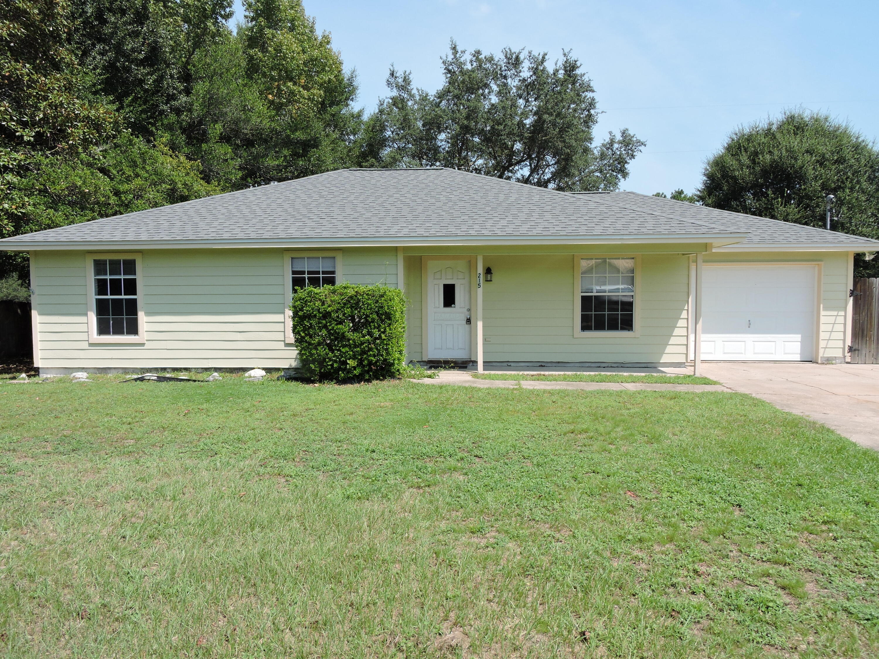 Available Now! Freshly painted throughout 3 bedroom/2 bath/1 car garage home located South of I-10 off of PJ Adams with easy commute to Eglin AFB, 7th Group.  The home features cathedral ceilings in family room accented by a wood burning fireplace.  The galley style kitchen features ample countertop and cabinet space with a large deck of the dining area perfect for entertaining.  The backyard in fenced.  The bedrooms are nice sized with ample closet space.  Schedule your showing today!
