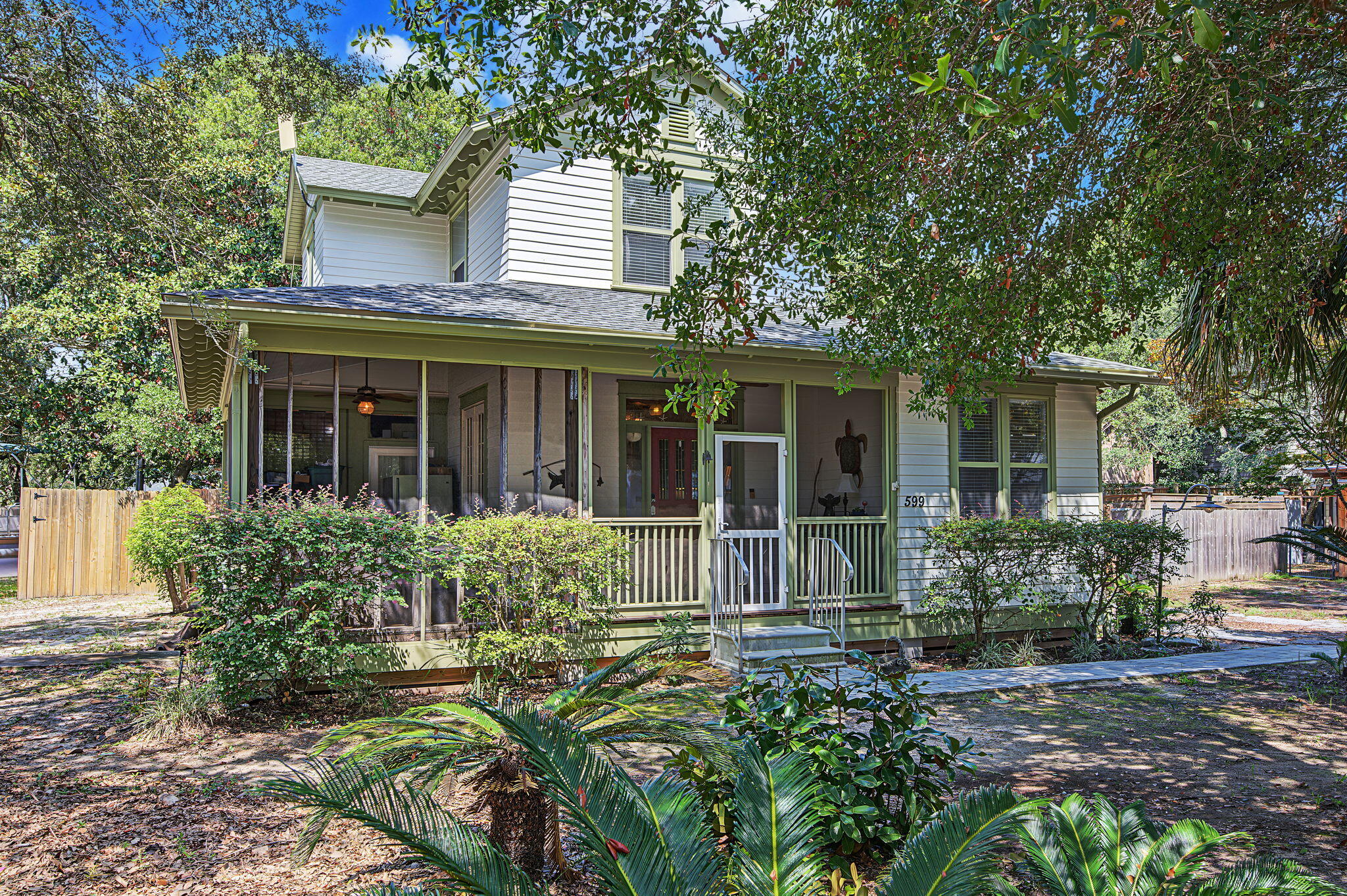 Located in the heart of Destin you'll find this charming Florida cottage sitting on over a 1/4-acre lot and surrounded by mature trees. This custom home features 4 bedrooms (with 1st floor master) and 3 full baths. A screened front porch gives this home just the right amount of southern charm. And if you work from home, you'll love the private office. The 2nd floor features 2 bedrooms with a Jack & Jill bath, spacious landing area at top of the stairs and closet with hookups for a 2nd laundry room. The position of this uniquely shaped corner lot allows plenty of privacy. And without an active HOA, you are able to utilize the land to suit your needs. 2 workshop/sheds are already onsite for all your storage needs, once which features 10' ceilings and electricity. Let's talk location - this home is conveniently located in the heart of Destin, close to schools, shopping, the harbor and 1/3 mile from Destin's public boat launch. This has been the builder's personal residence, so it is well built and needs nothing but a new owner's personal touch with some cosmetic updates.